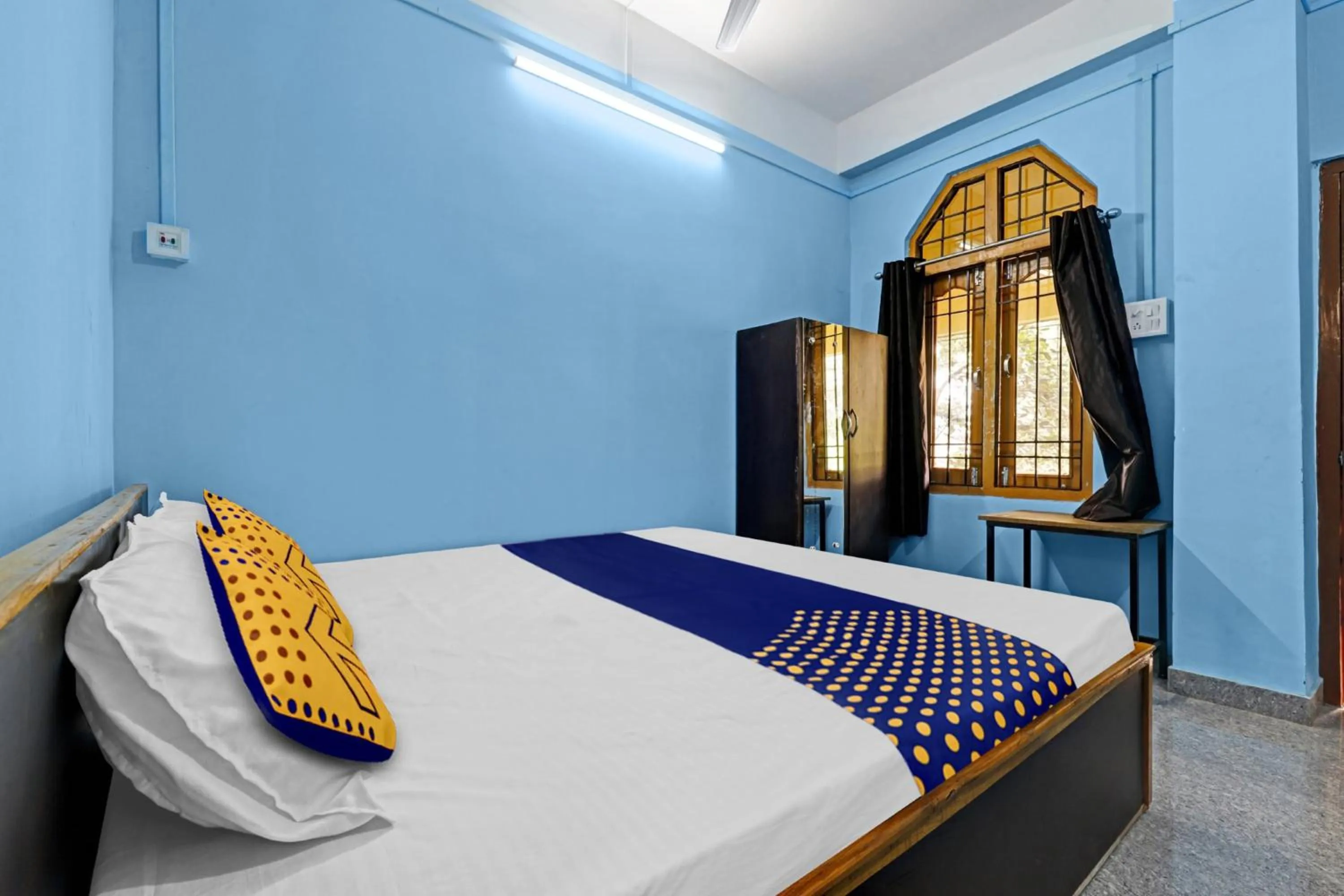 Bedroom in Hotel O Garam Masala Residency