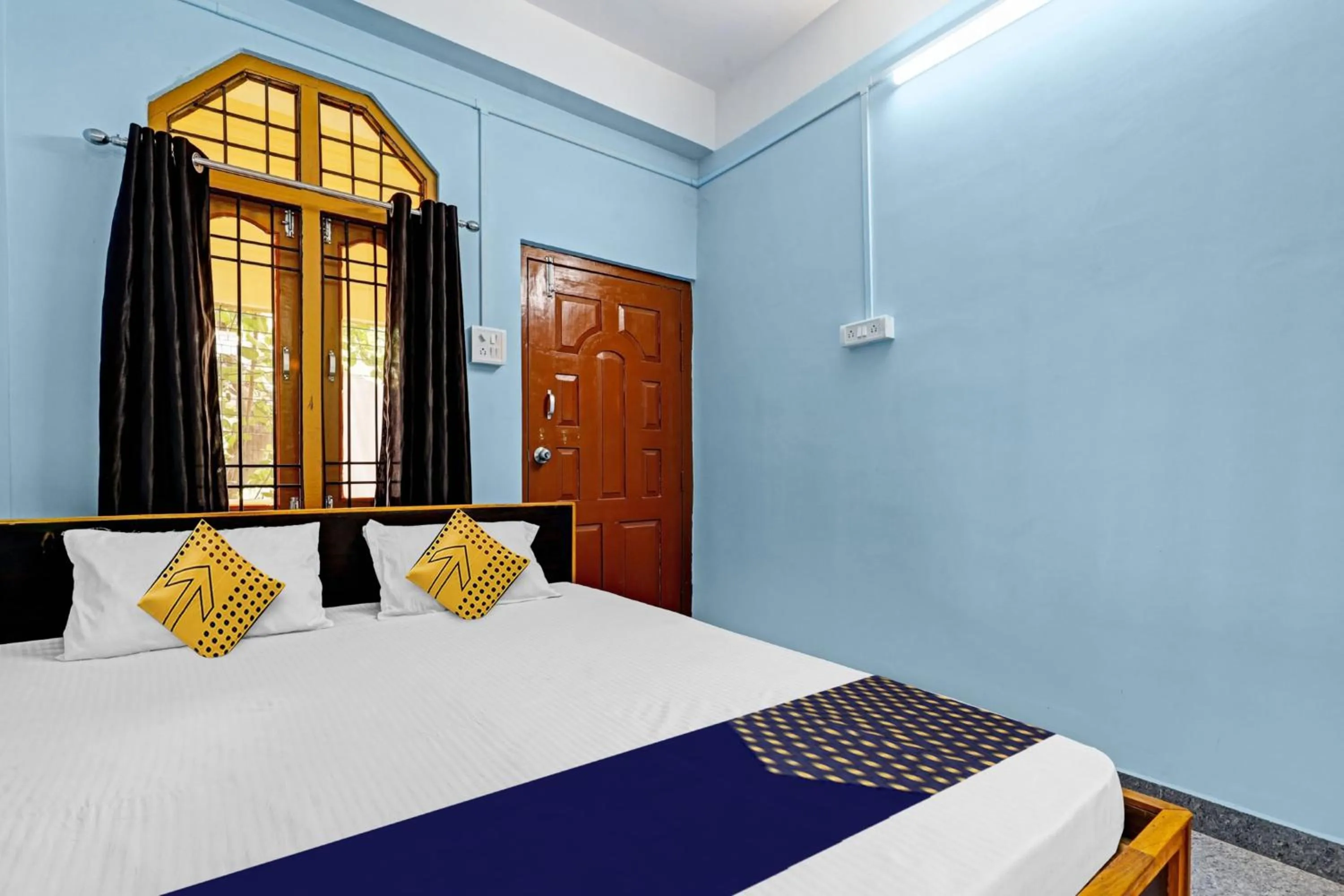 Bedroom in Hotel O Garam Masala Residency