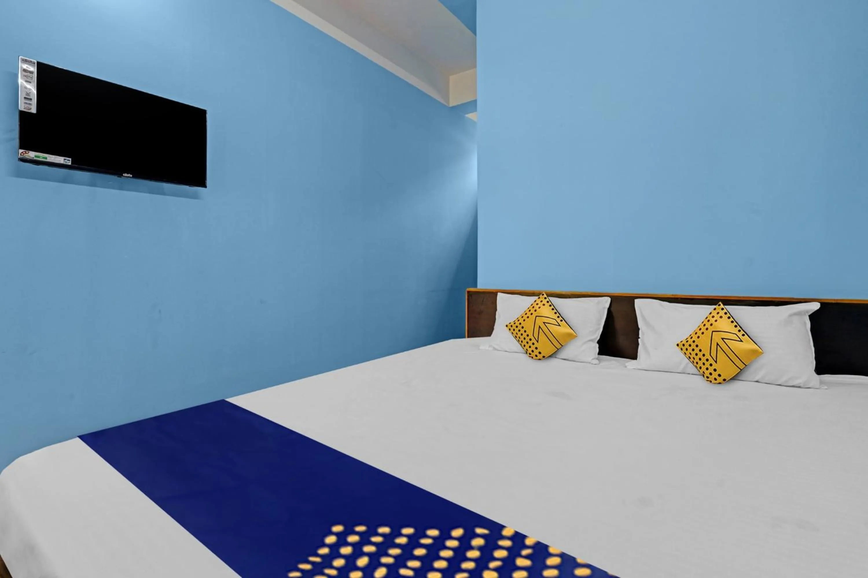 Bedroom in Hotel O Garam Masala Residency