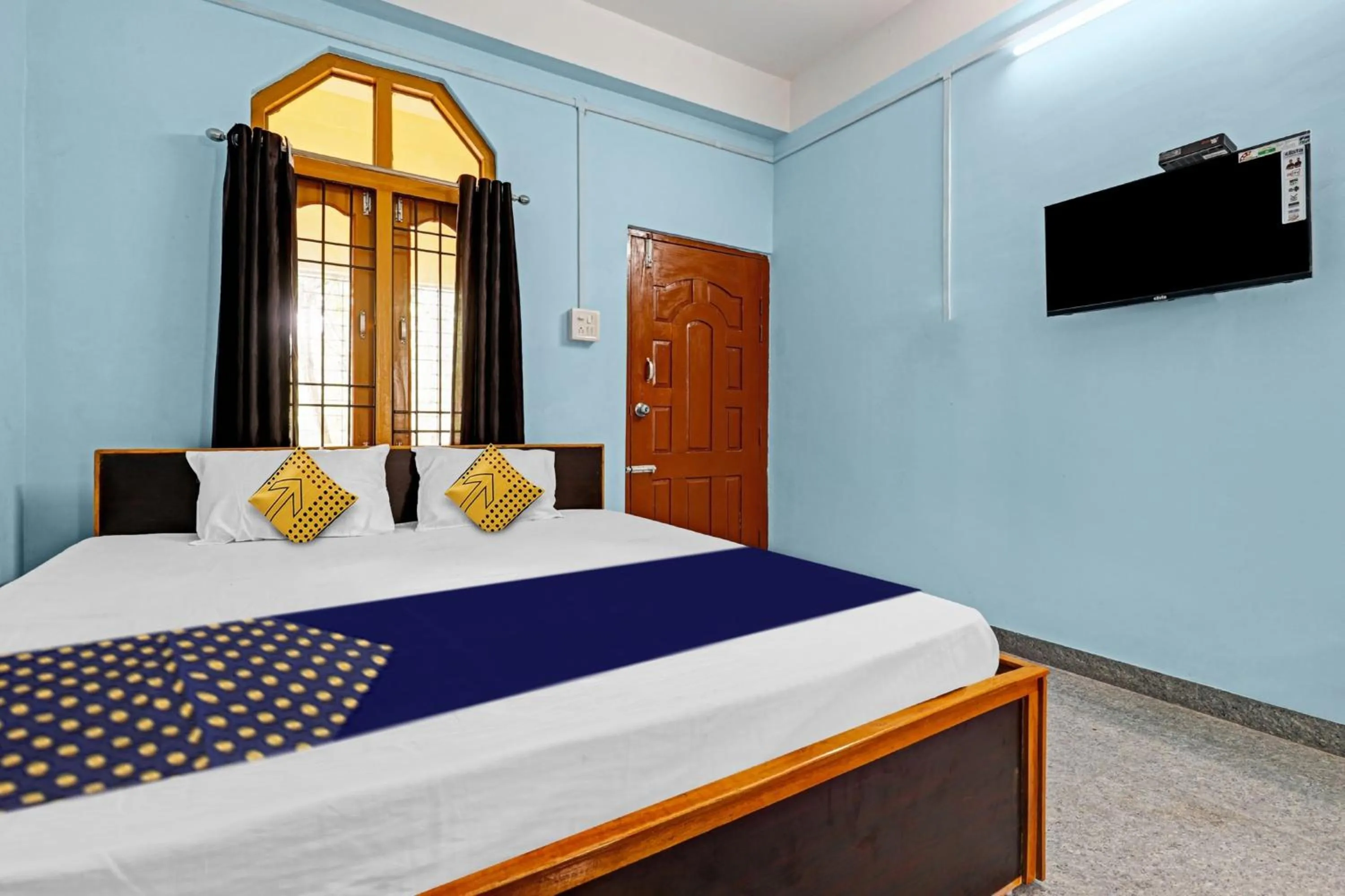 Bedroom in Hotel O Garam Masala Residency