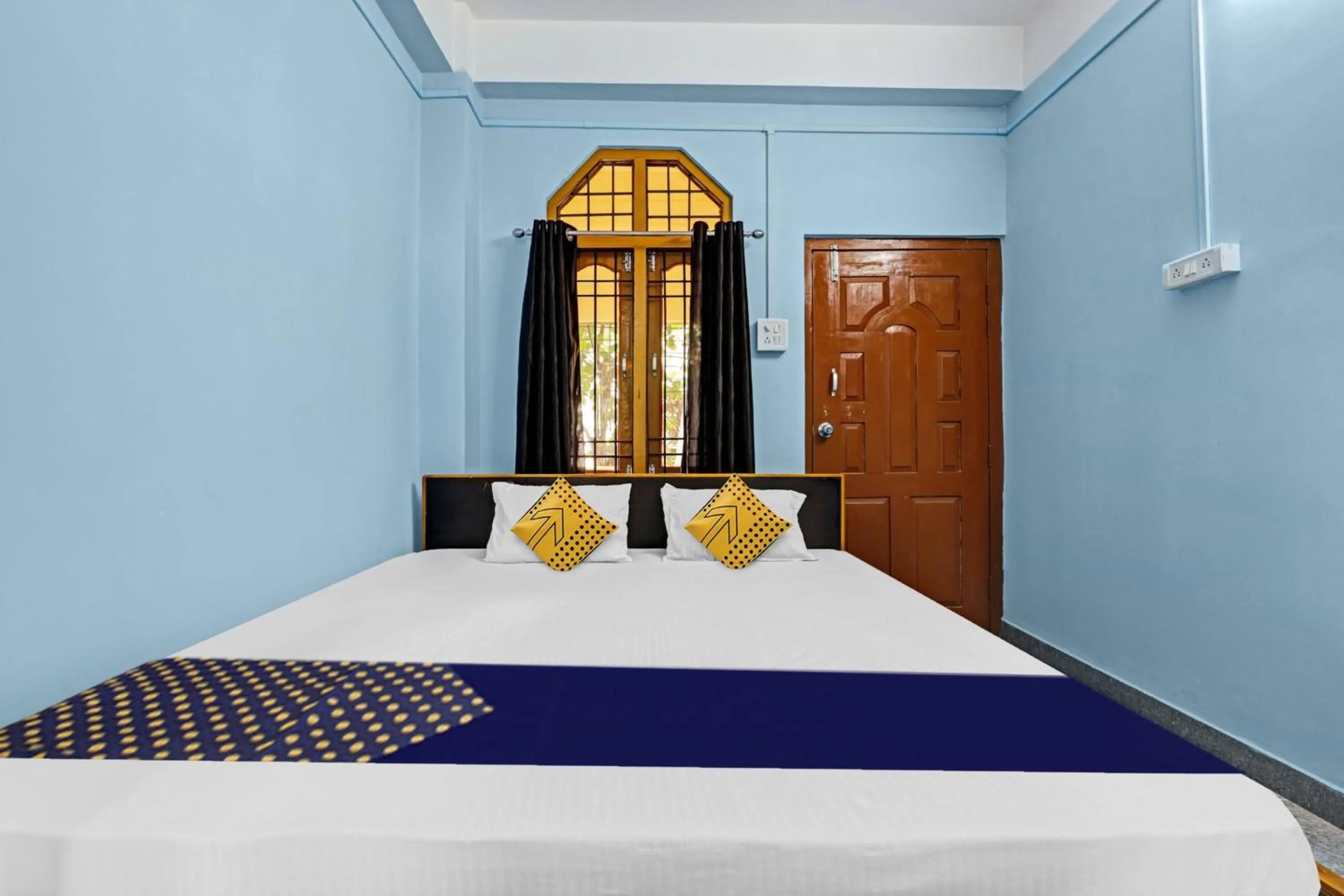 Bedroom in Hotel O Garam Masala Residency