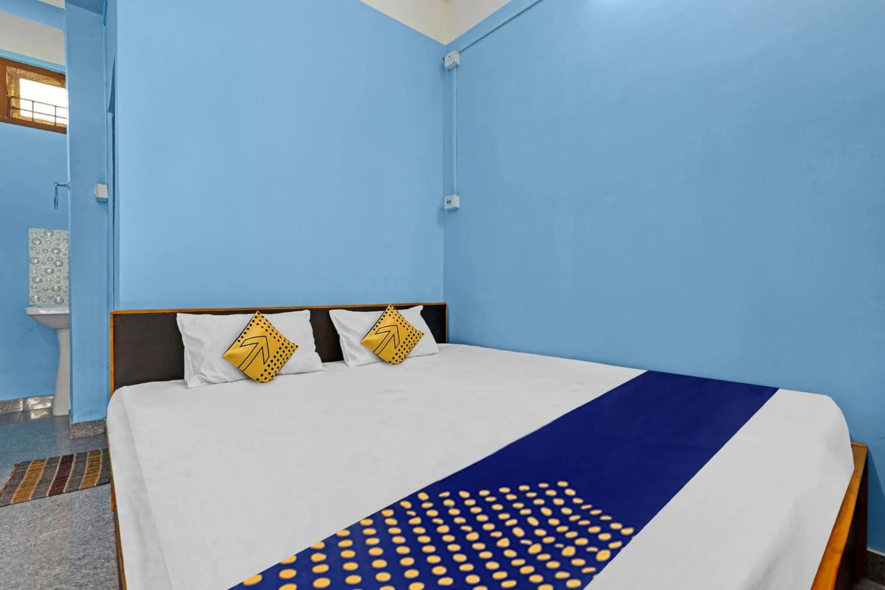 Bedroom in Hotel O Garam Masala Residency