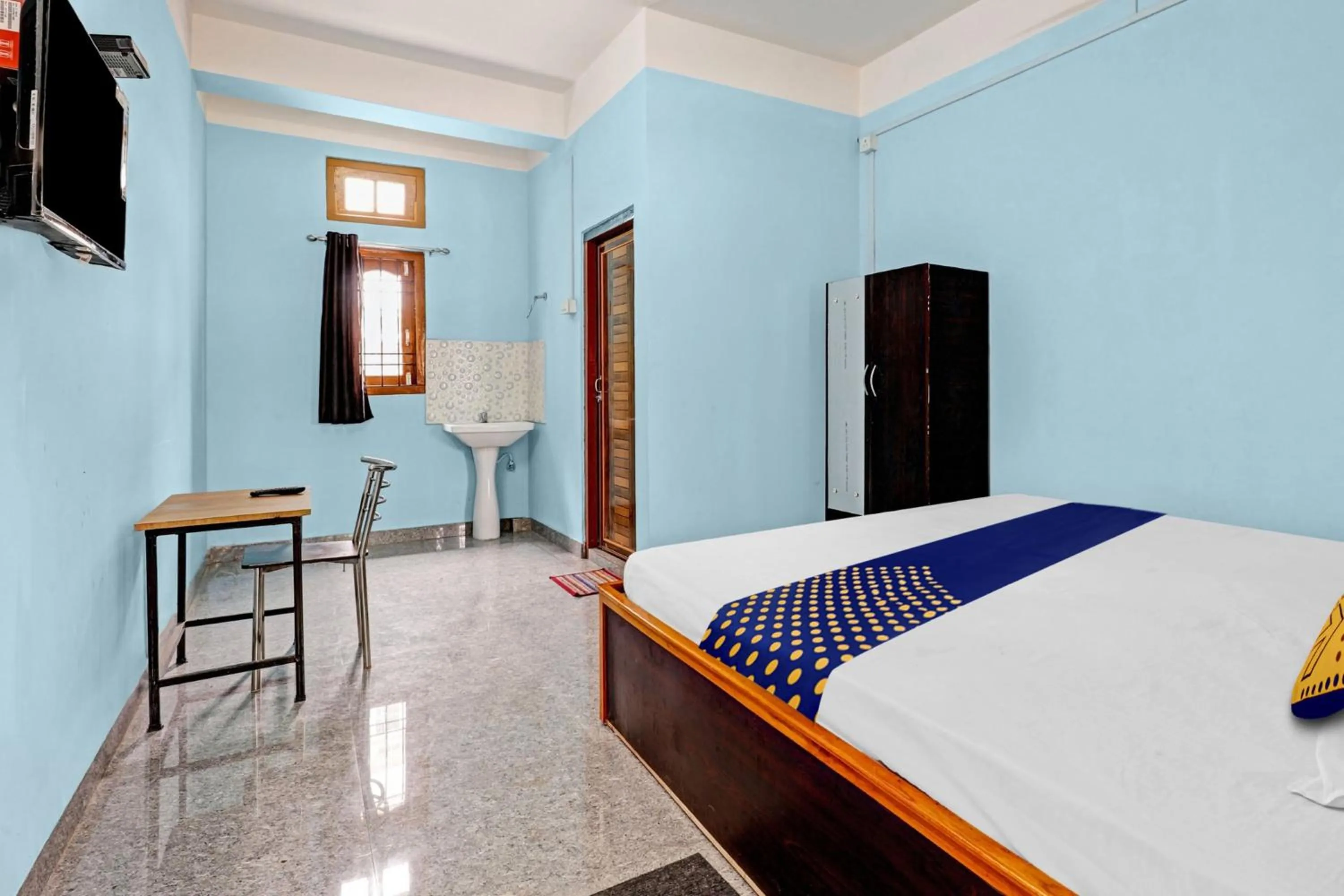 Bedroom in Hotel O Garam Masala Residency