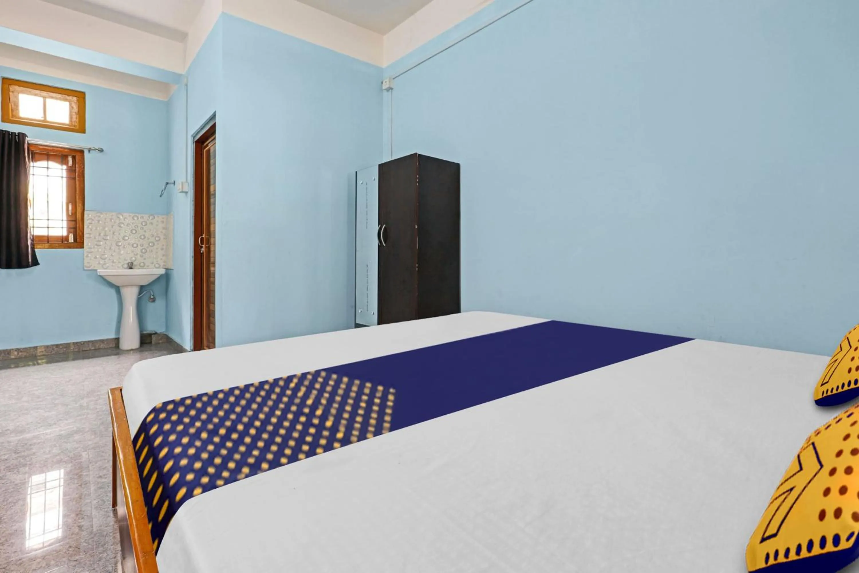 Bedroom in Hotel O Garam Masala Residency