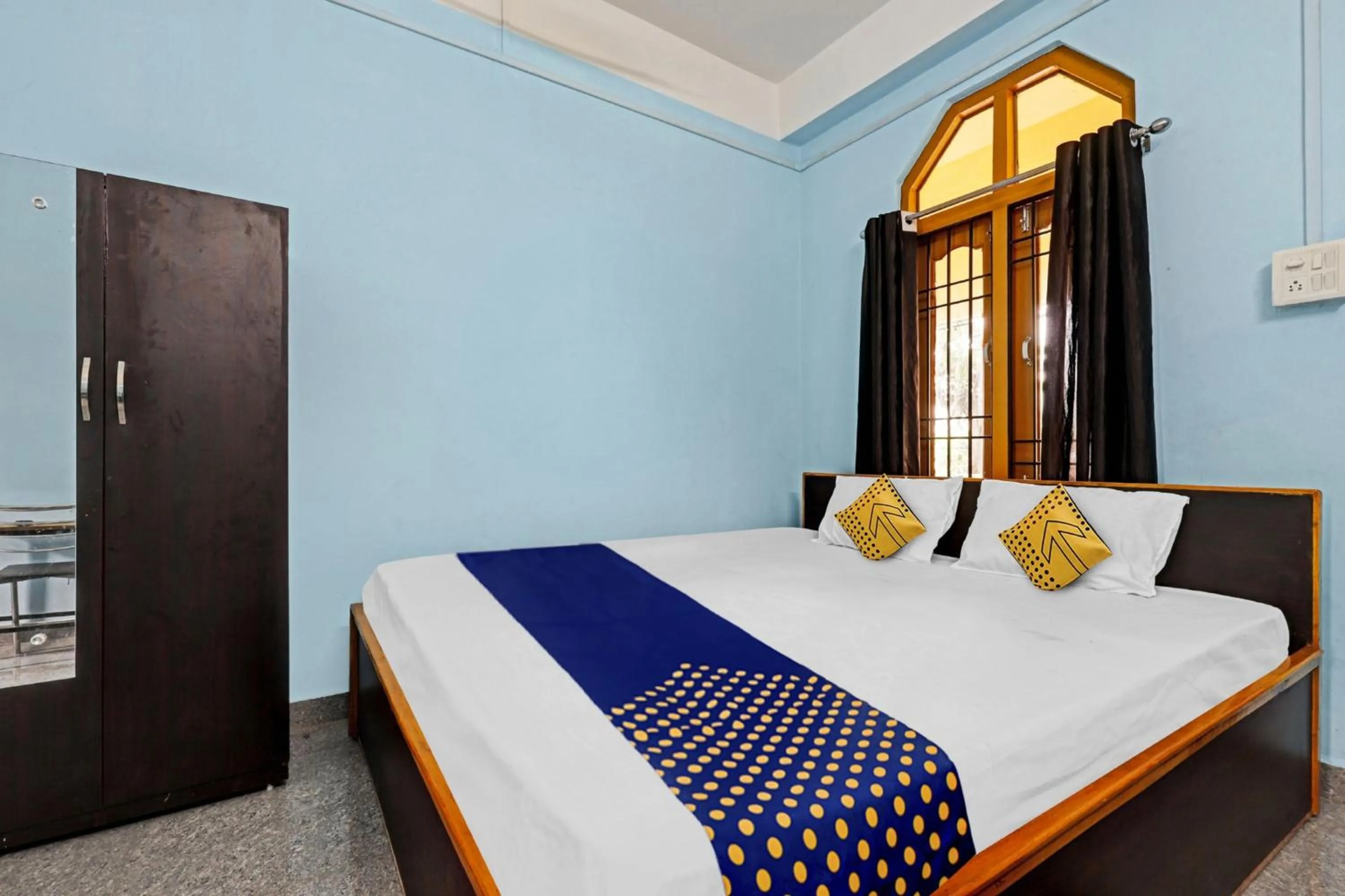 Bedroom in Hotel O Garam Masala Residency