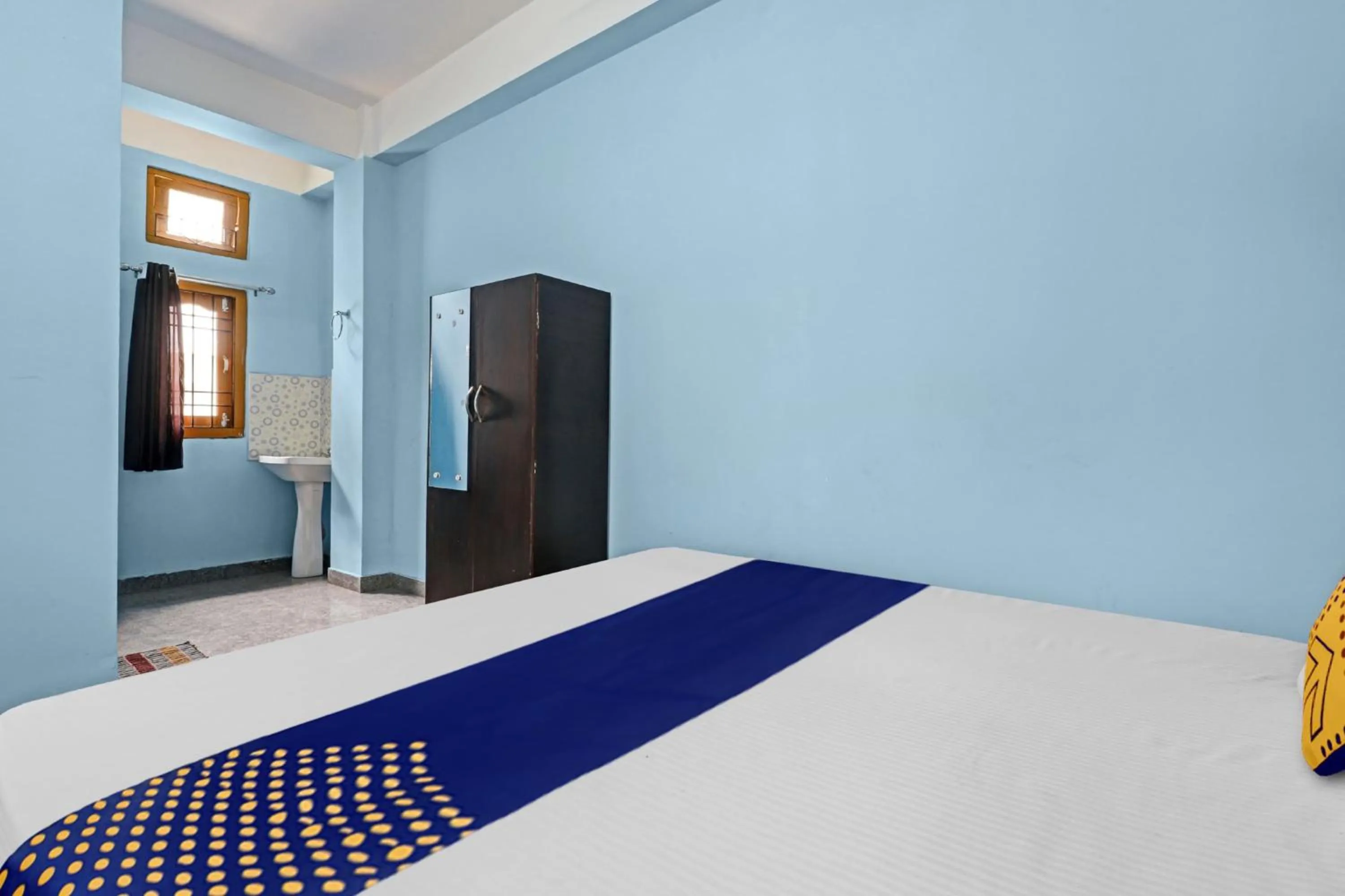 Bedroom in Hotel O Garam Masala Residency