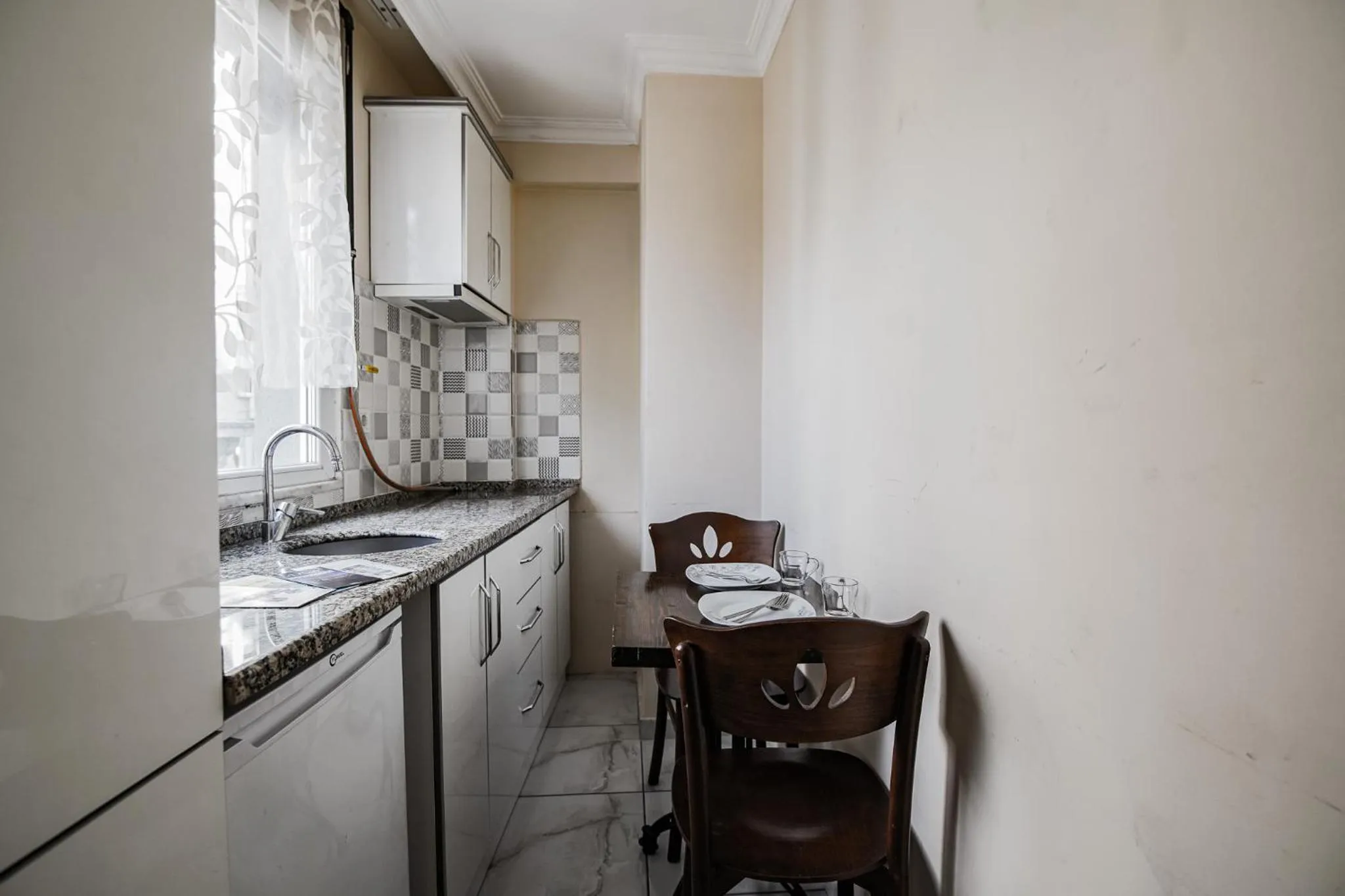 Kitchen or kitchenette in MITANI SUITES