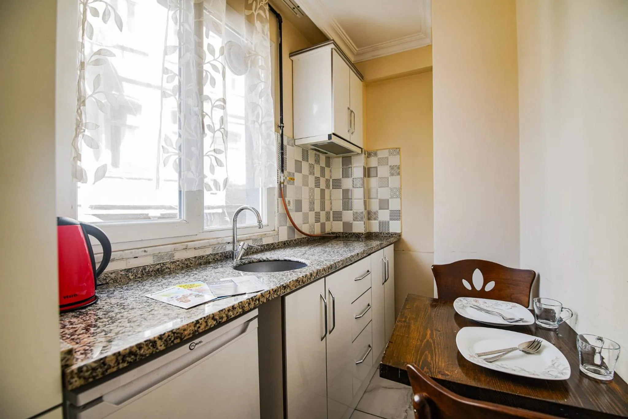 Kitchen or kitchenette in MITANI SUITES