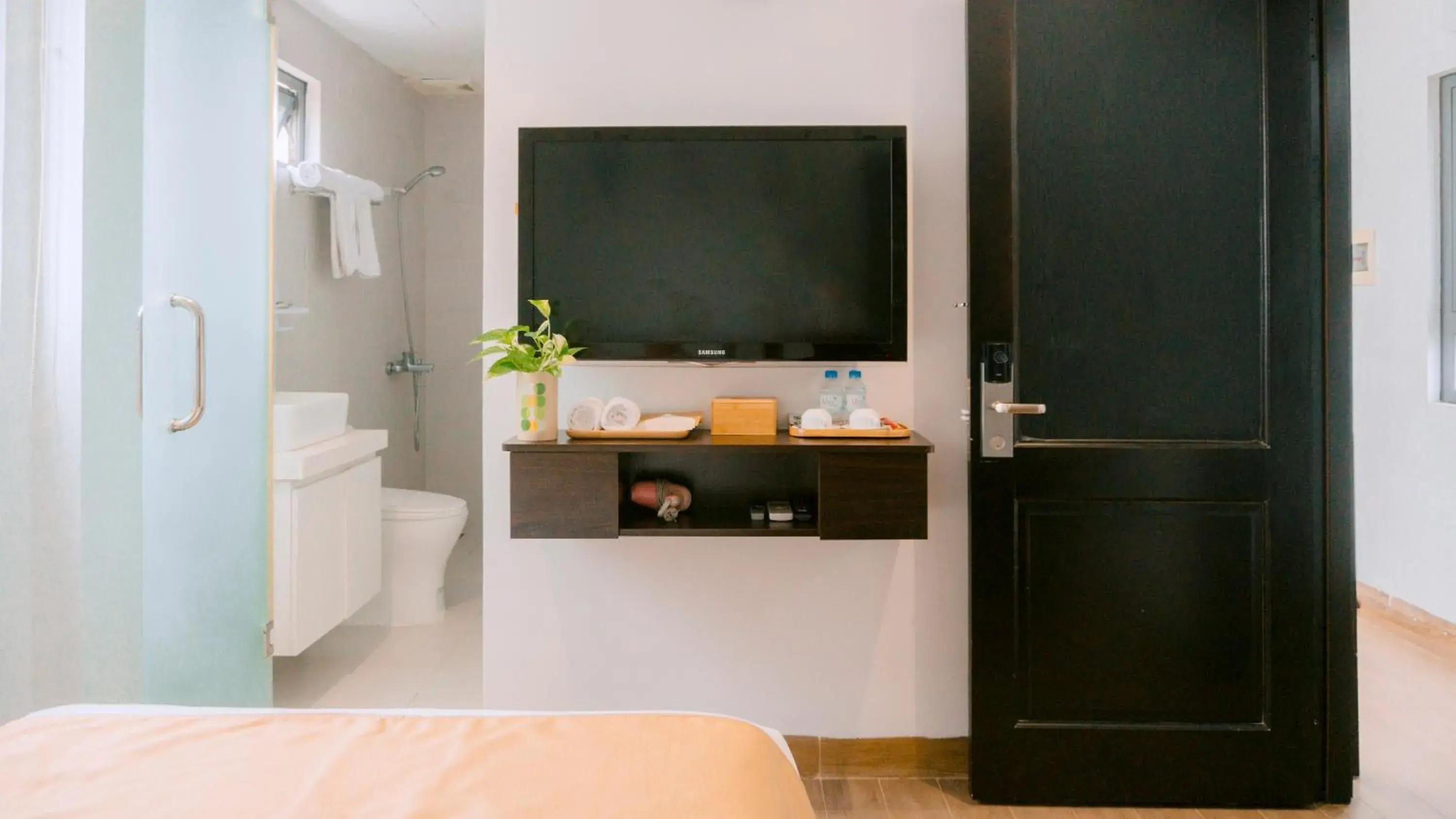 Shower, Bed in Horizon Front Beach Hotel Danang Shower, Bed in Horizon Front Beach Hotel Danang