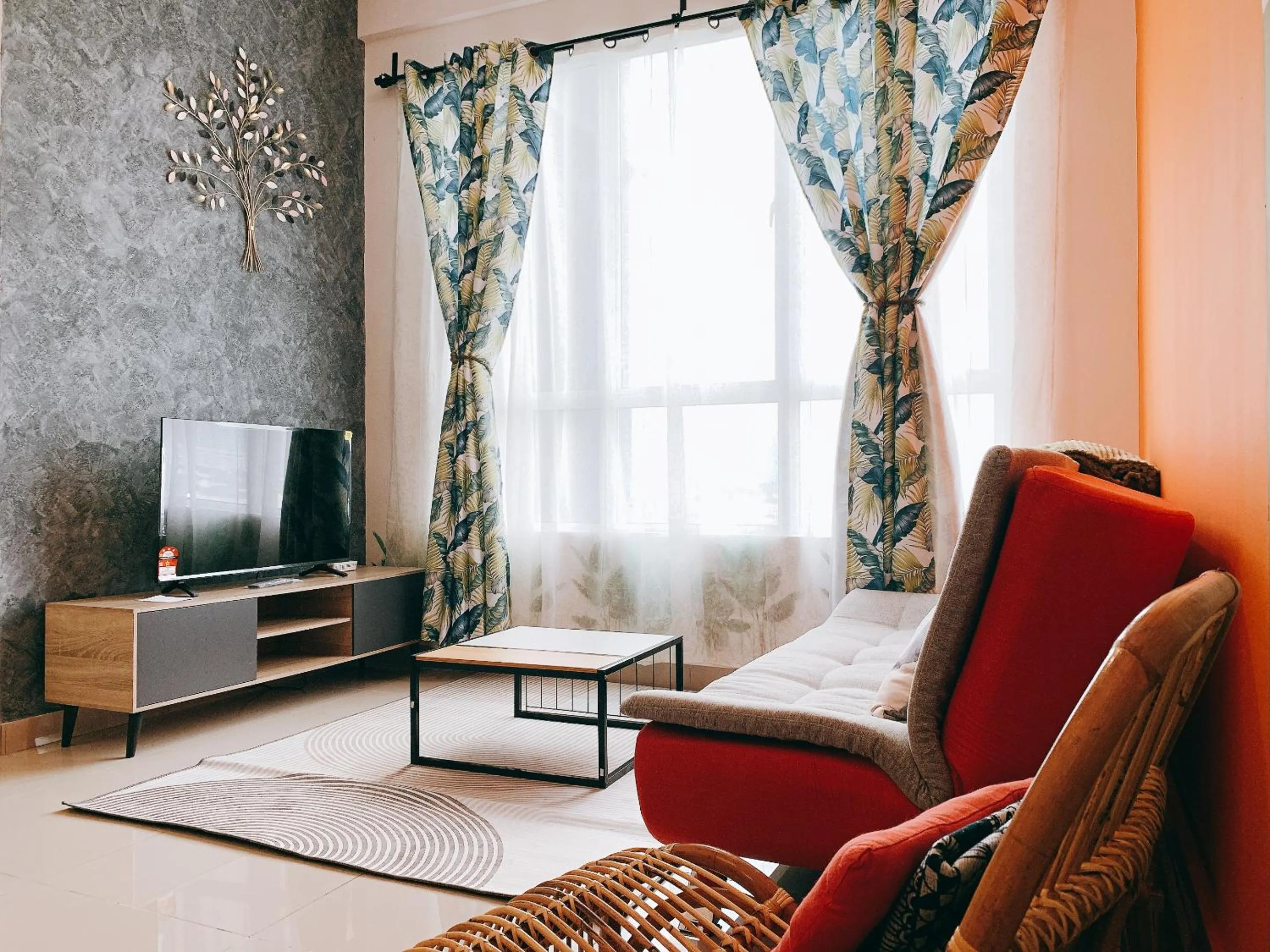 Communal lounge/ TV room in Amber Cove Impression City Melaka By Dawn Stay Free Netflix