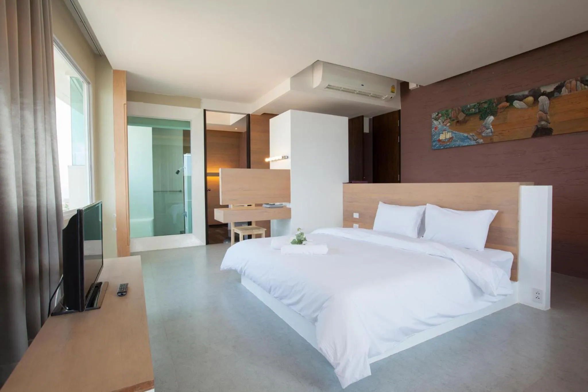 Bed in O-Bay Design Hotel Prachuap