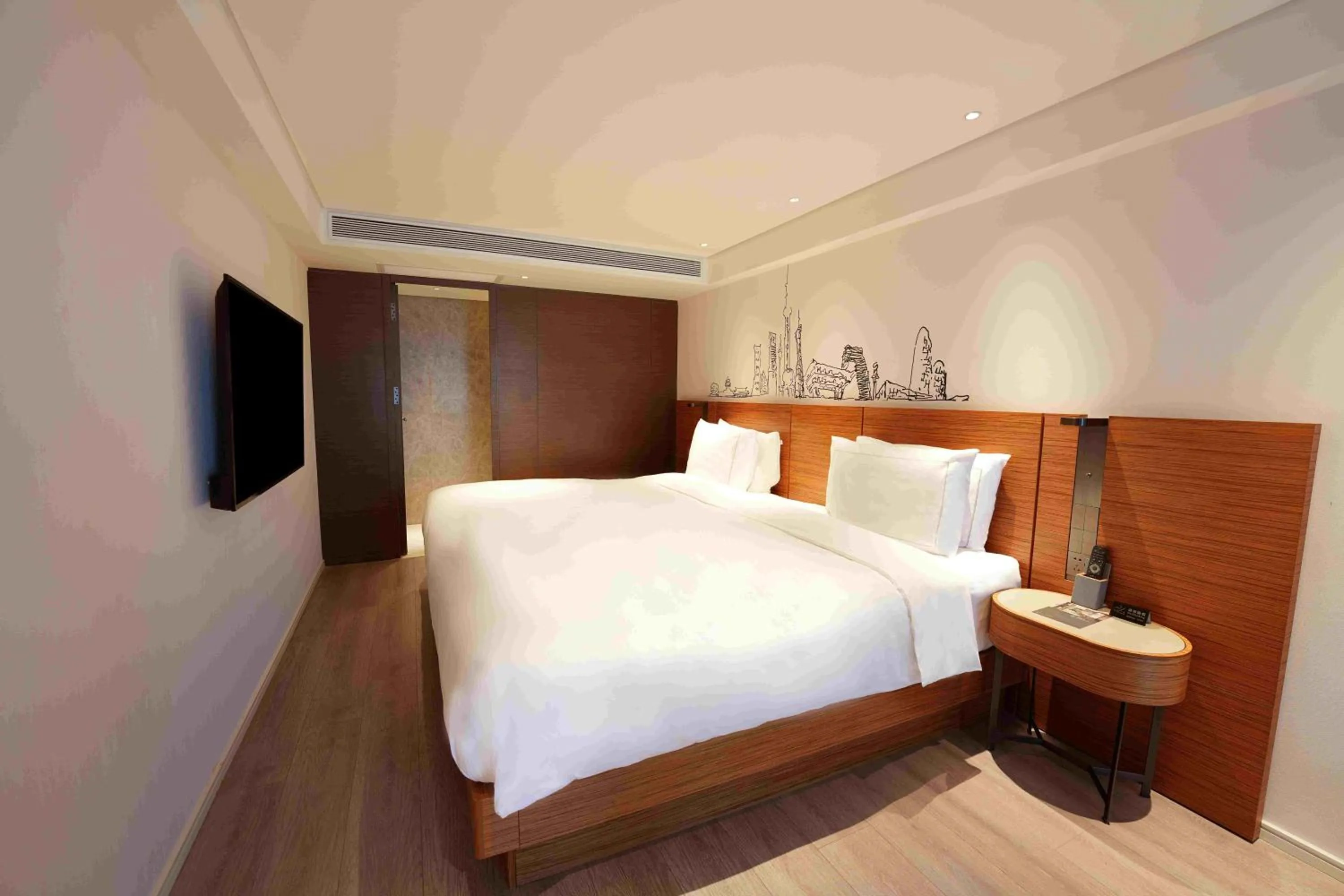 Photo of the whole room, Bed in UrCove by Hyatt Shanghai Lujiazui Expo Center