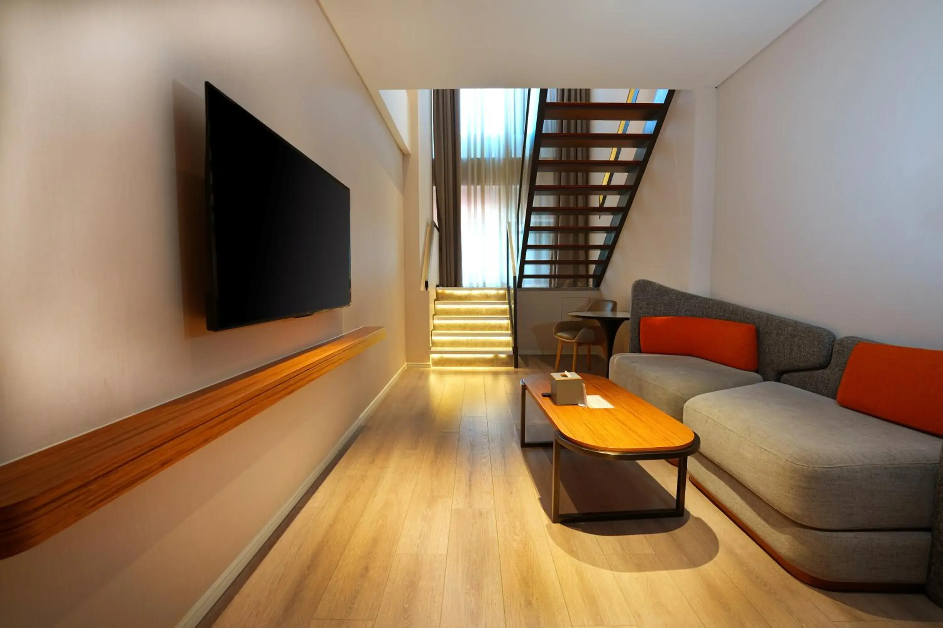 Living room in UrCove by Hyatt Shanghai Lujiazui Expo Center Living room in UrCove by Hyatt Shanghai Lujiazui Expo Center