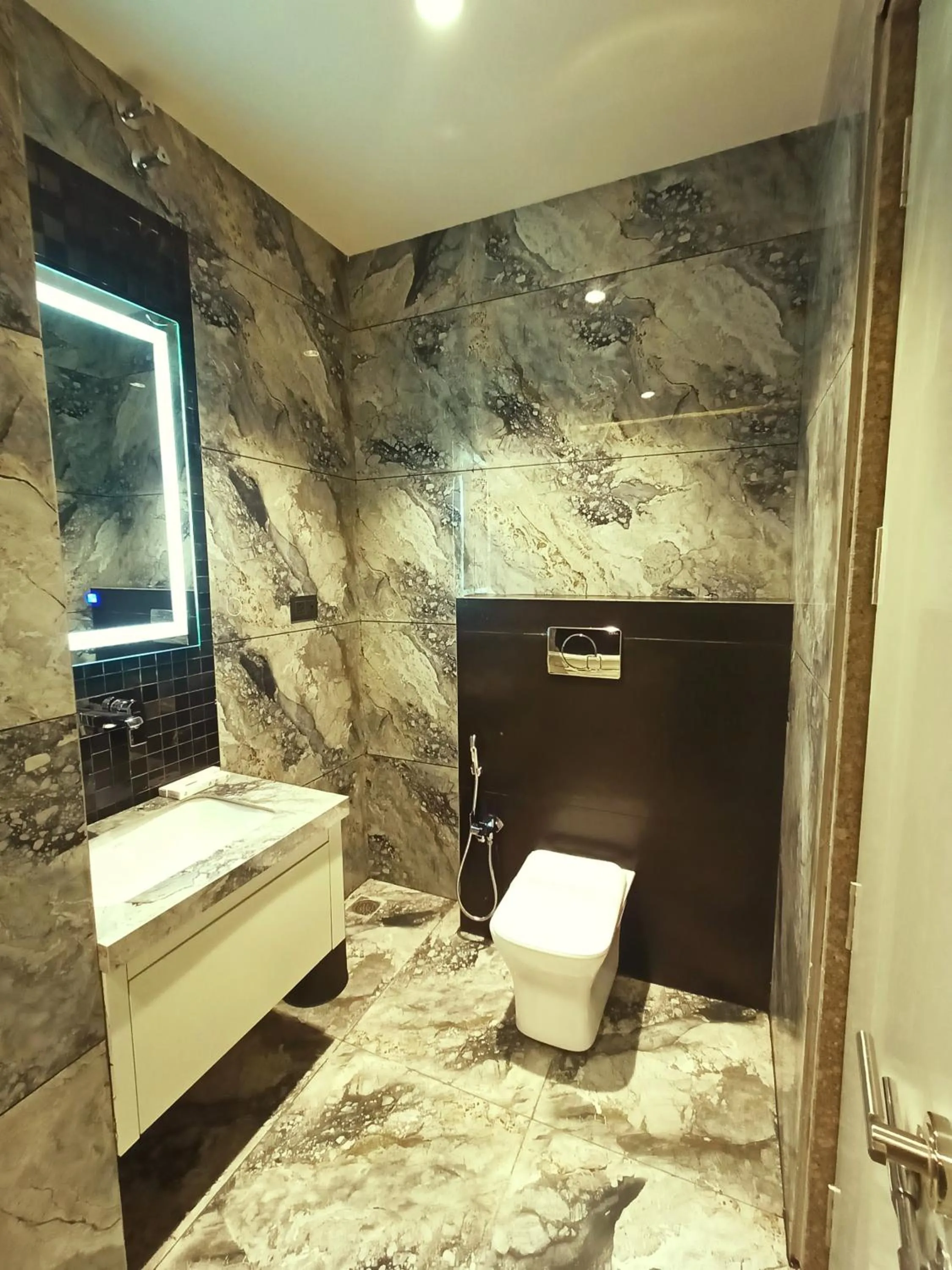 Shower in Radhamangal Colors Inn