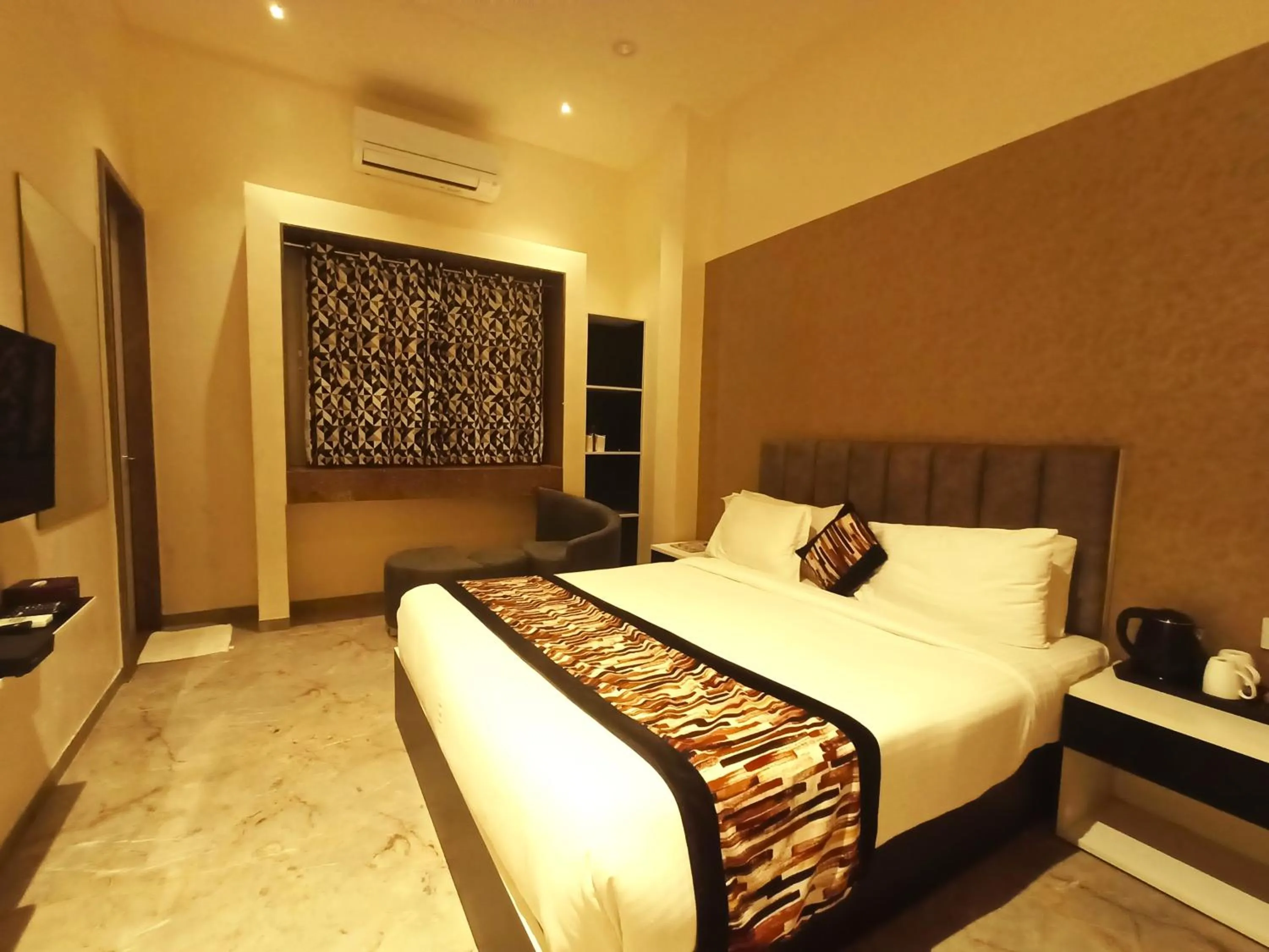 Bed in Radhamangal Colors Inn