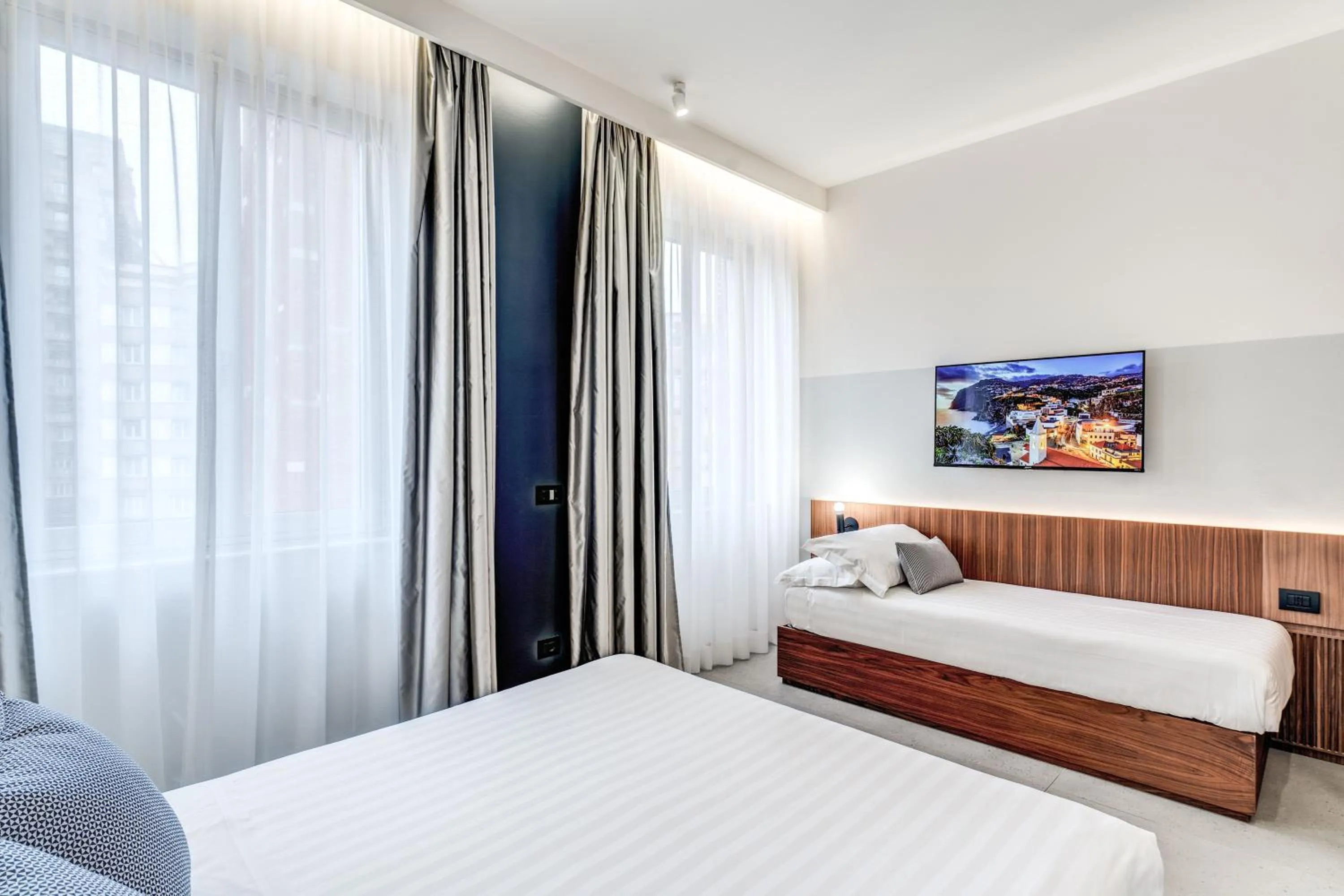 Bed in Sospeso Boutique Hotel