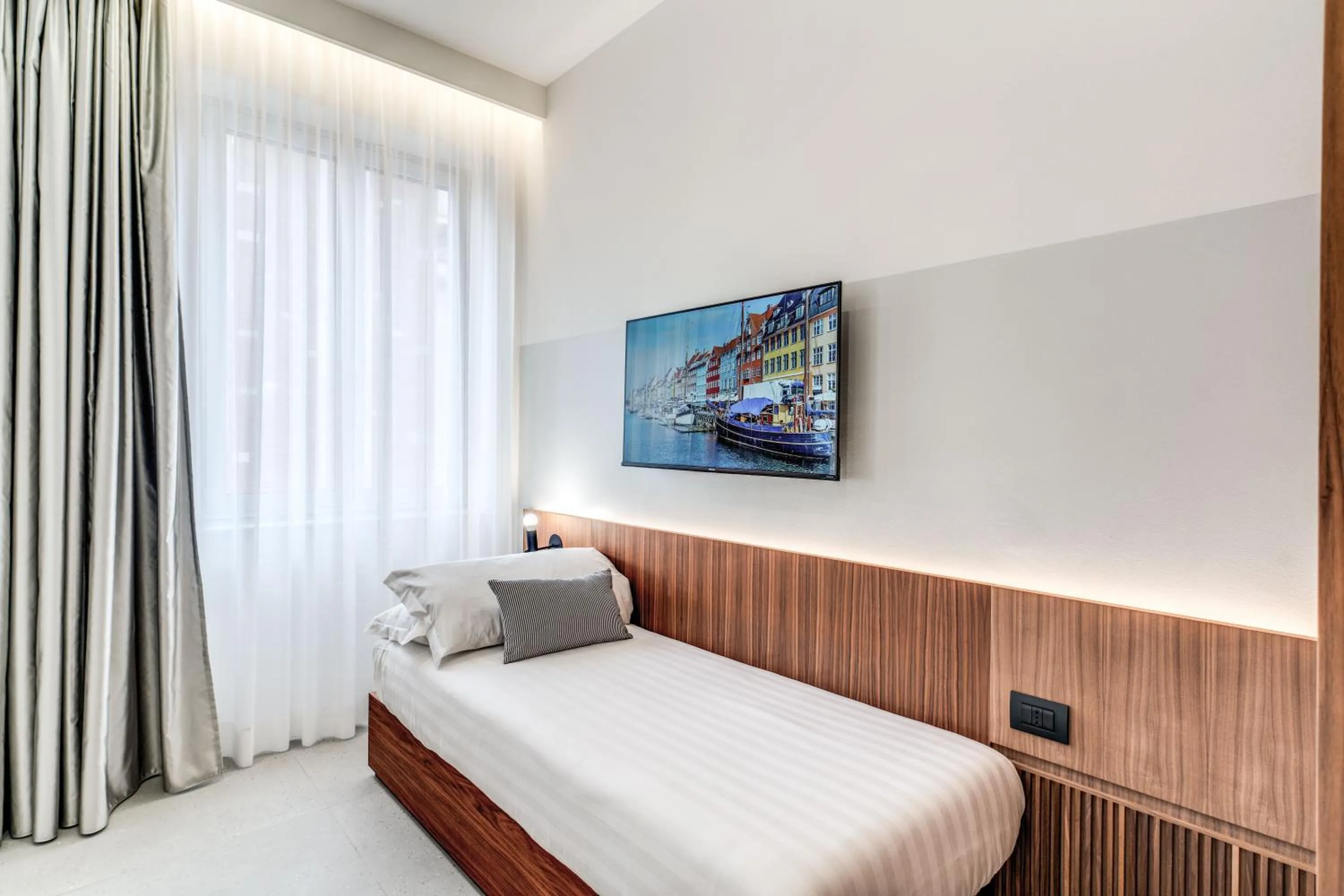 Bed in Sospeso Boutique Hotel