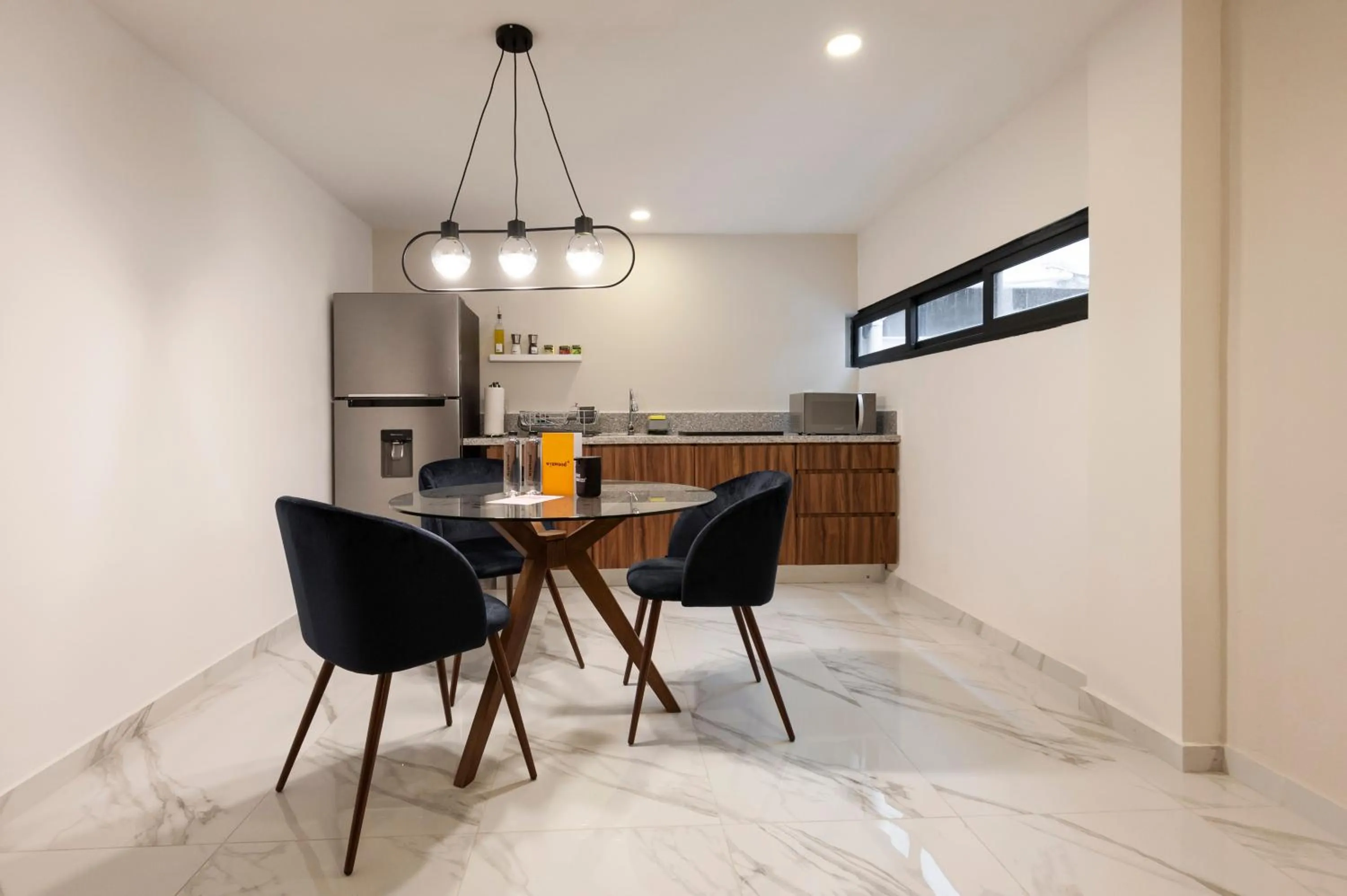 Dining area in Allan Poe 343 by Wynwood House