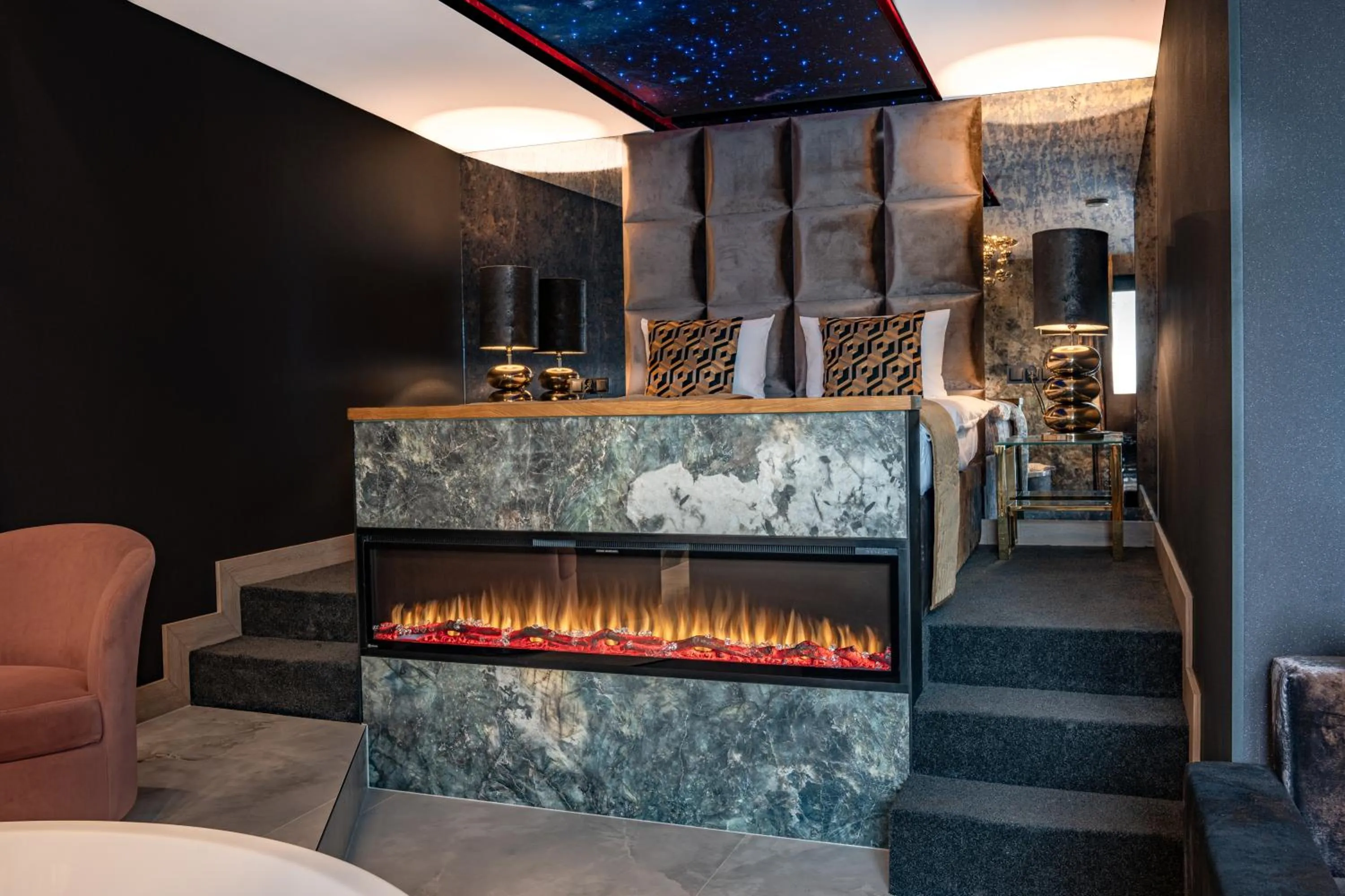 Bed in Art Suites Luxury Hotel