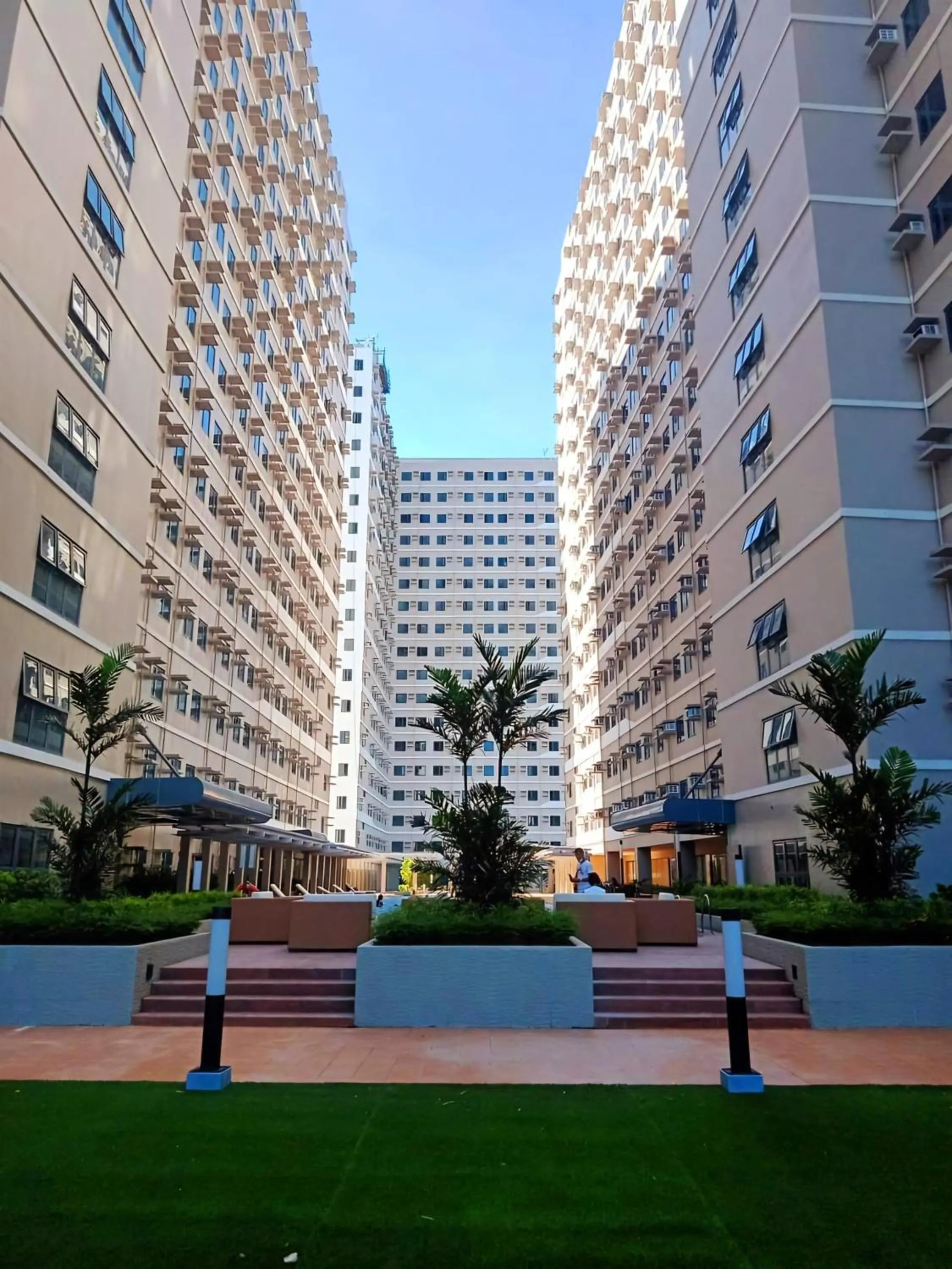 Property building in Acellyne's Suites at Green 2 Residences with Netflix!