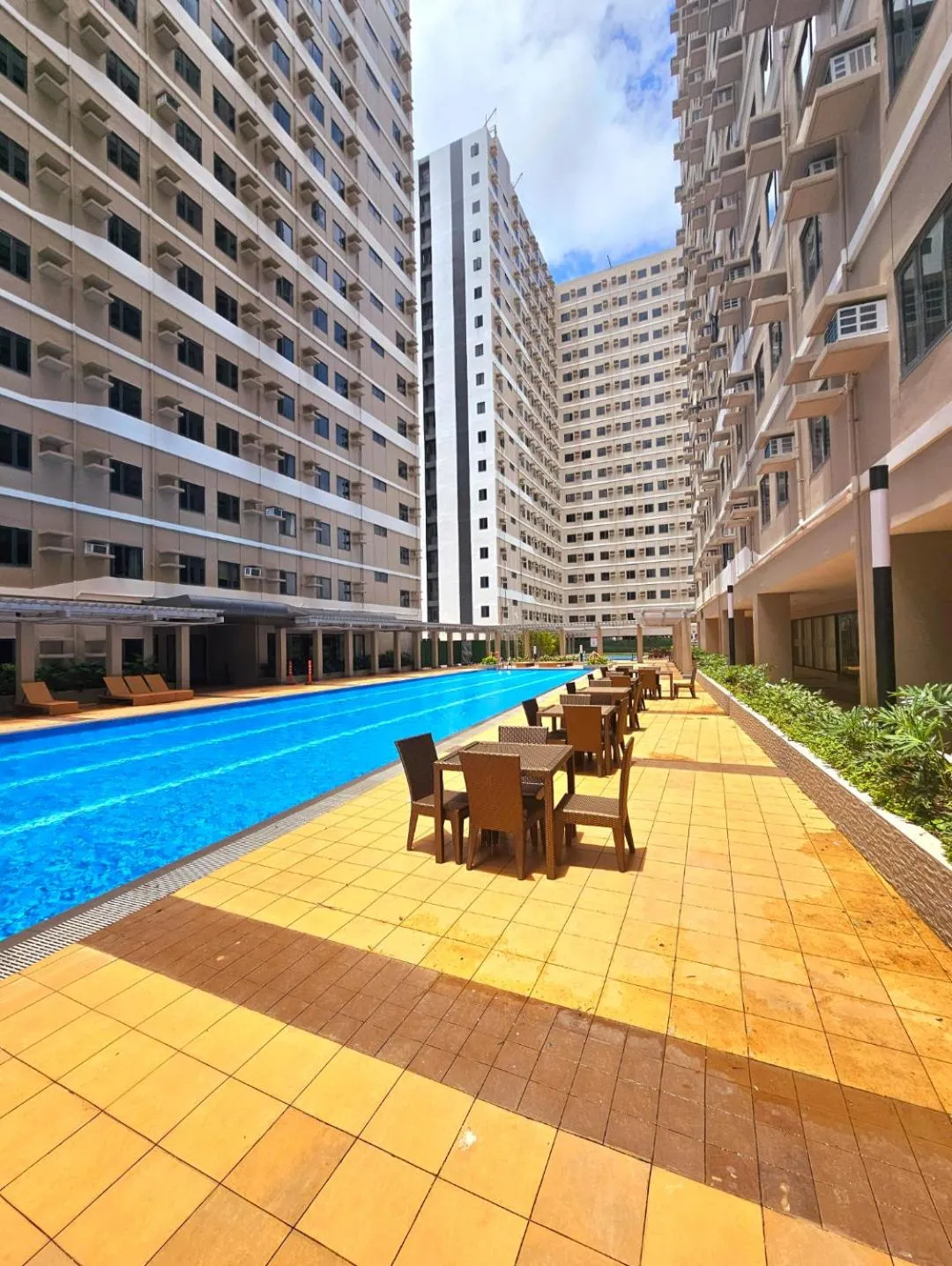 Property building in Acellyne's Suites at Green 2 Residences with Netflix!