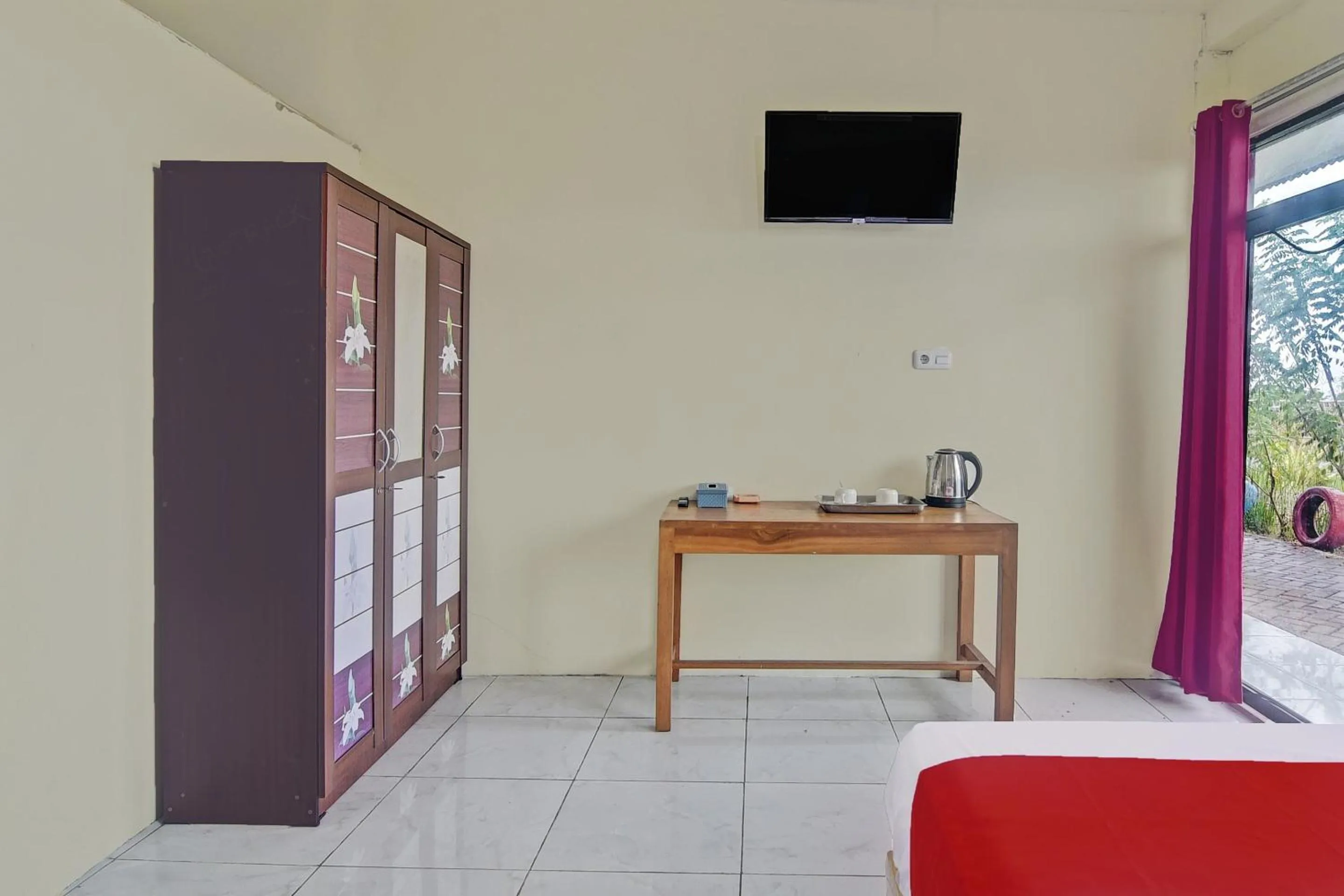 Bedroom in Hotel O Wawi Kadio Homestay