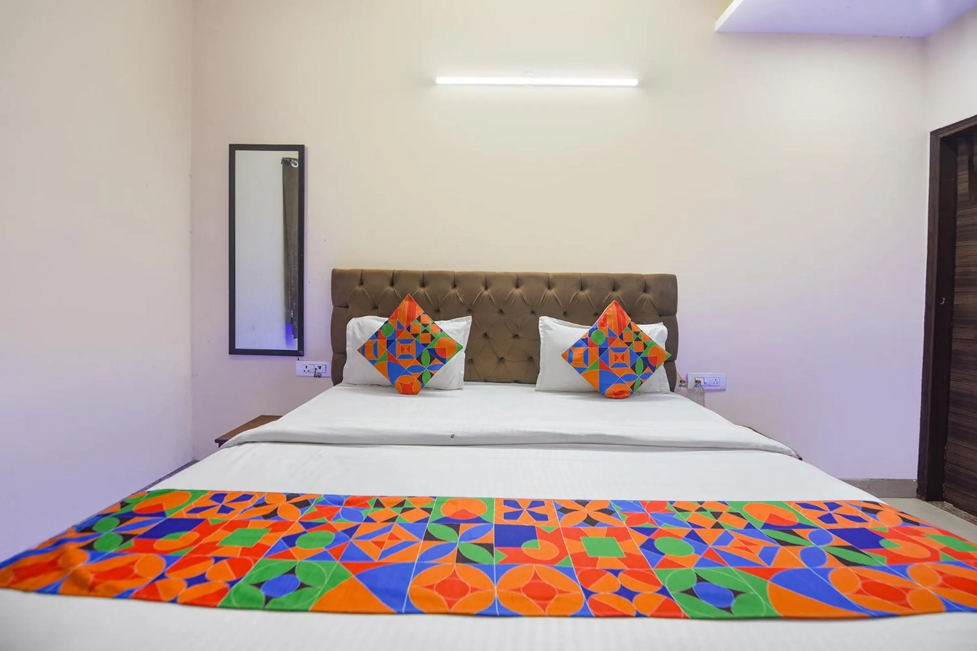 Bedroom in FabHotel Mannat Bhera Enclave