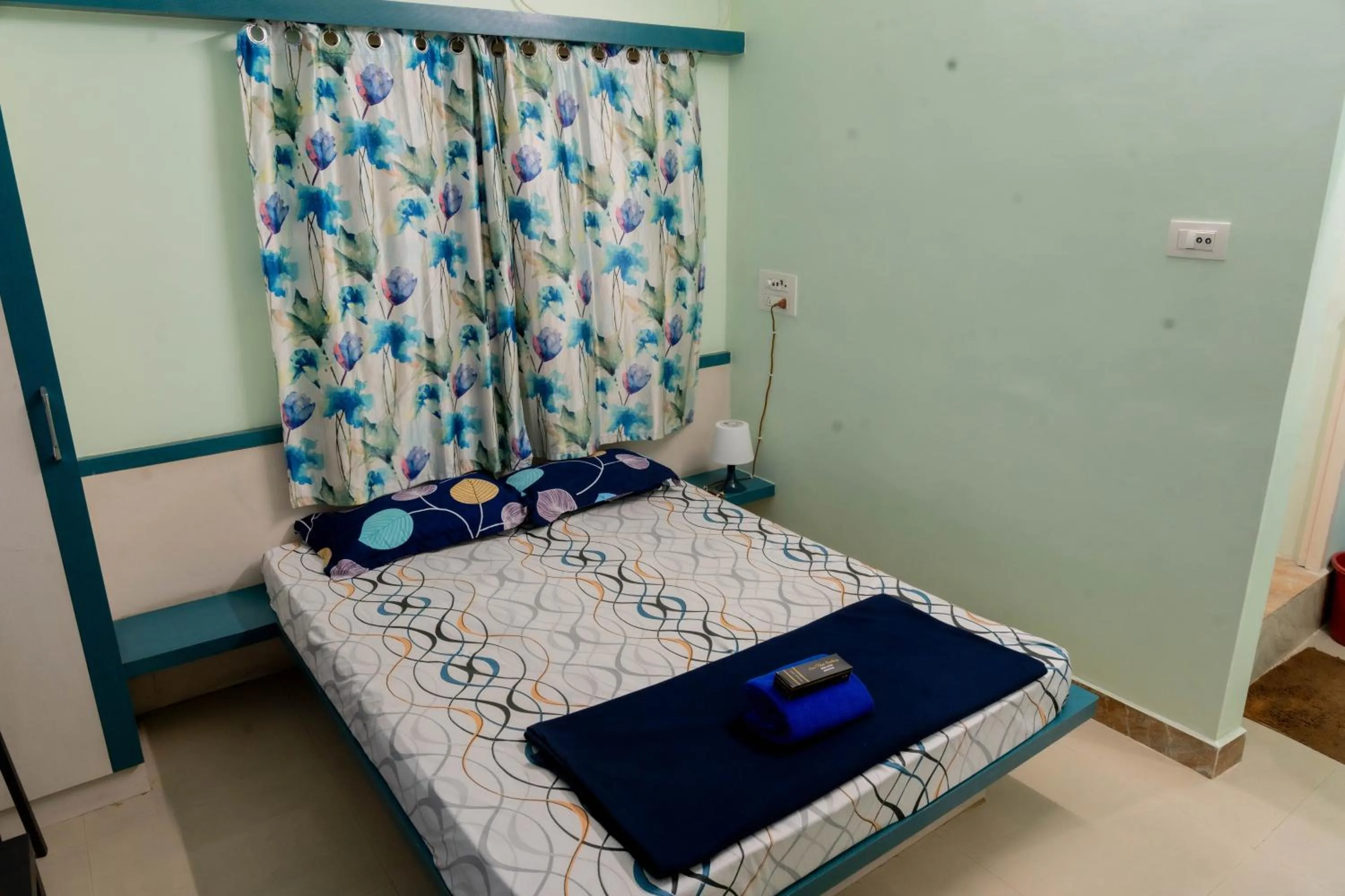 Bedroom, Bed in Sree Theja Residency