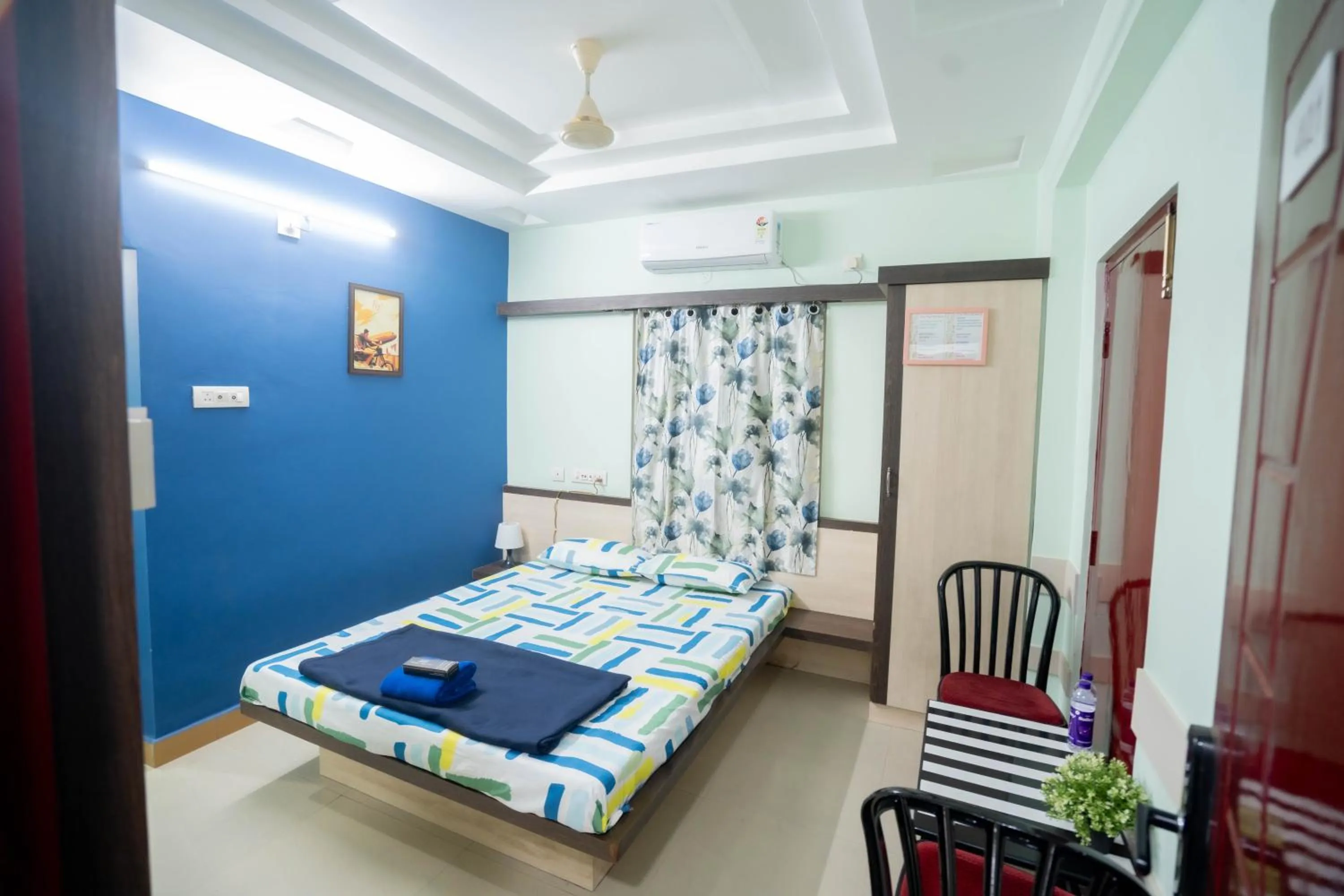 Photo of the whole room, Bed in Sree Theja Residency