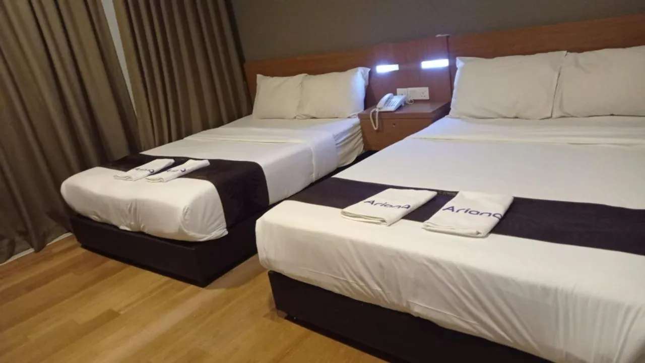 Bed in Golden Leaf Boutique Hotel Nusa Idaman Formerly Known as Ariana Hotel