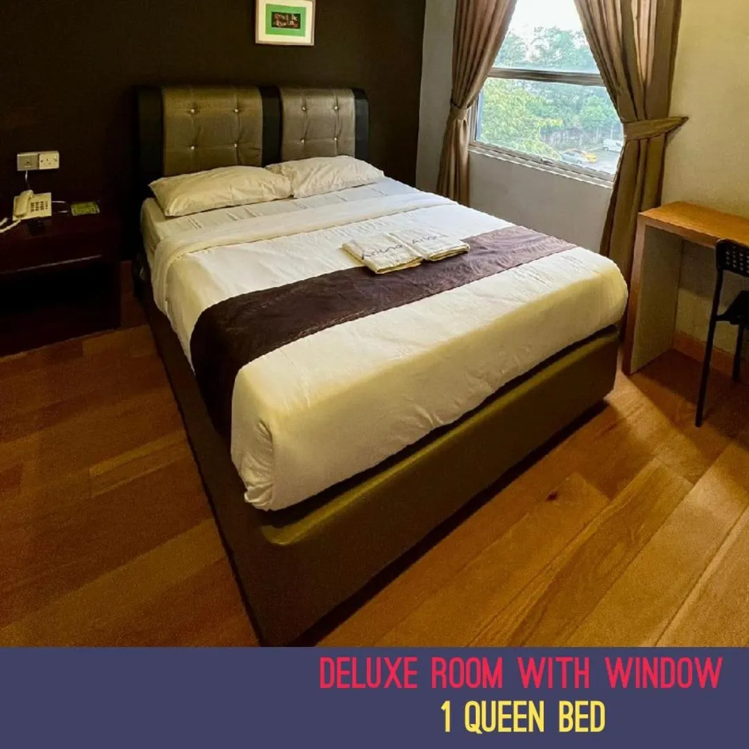Bed in Golden Leaf Boutique Hotel Nusa Idaman Formerly Known as Ariana Hotel