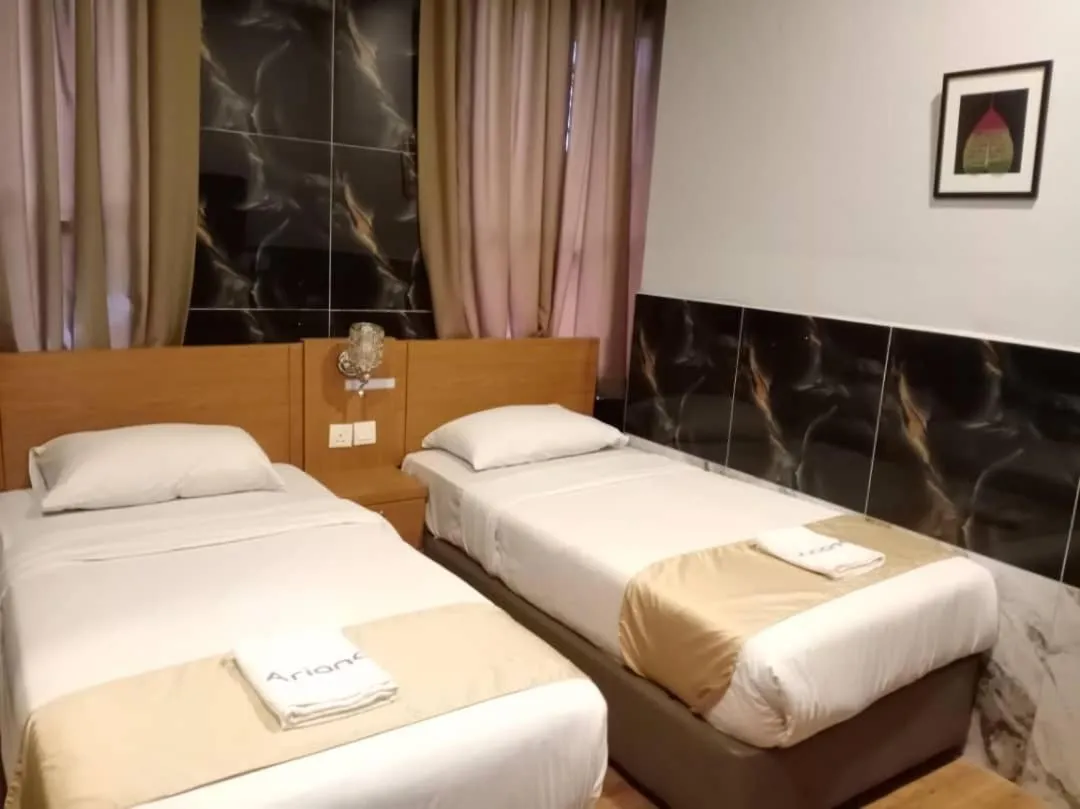 Bed in Golden Leaf Boutique Hotel Nusa Idaman Formerly Known as Ariana Hotel