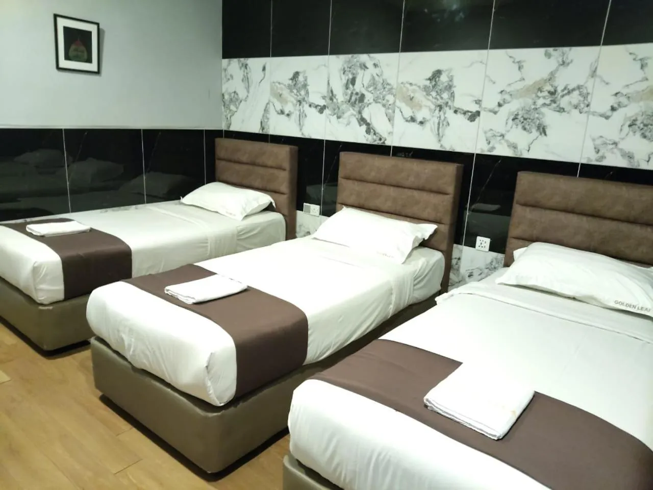 Bed in Golden Leaf Boutique Hotel Nusa Idaman Formerly Known as Ariana Hotel