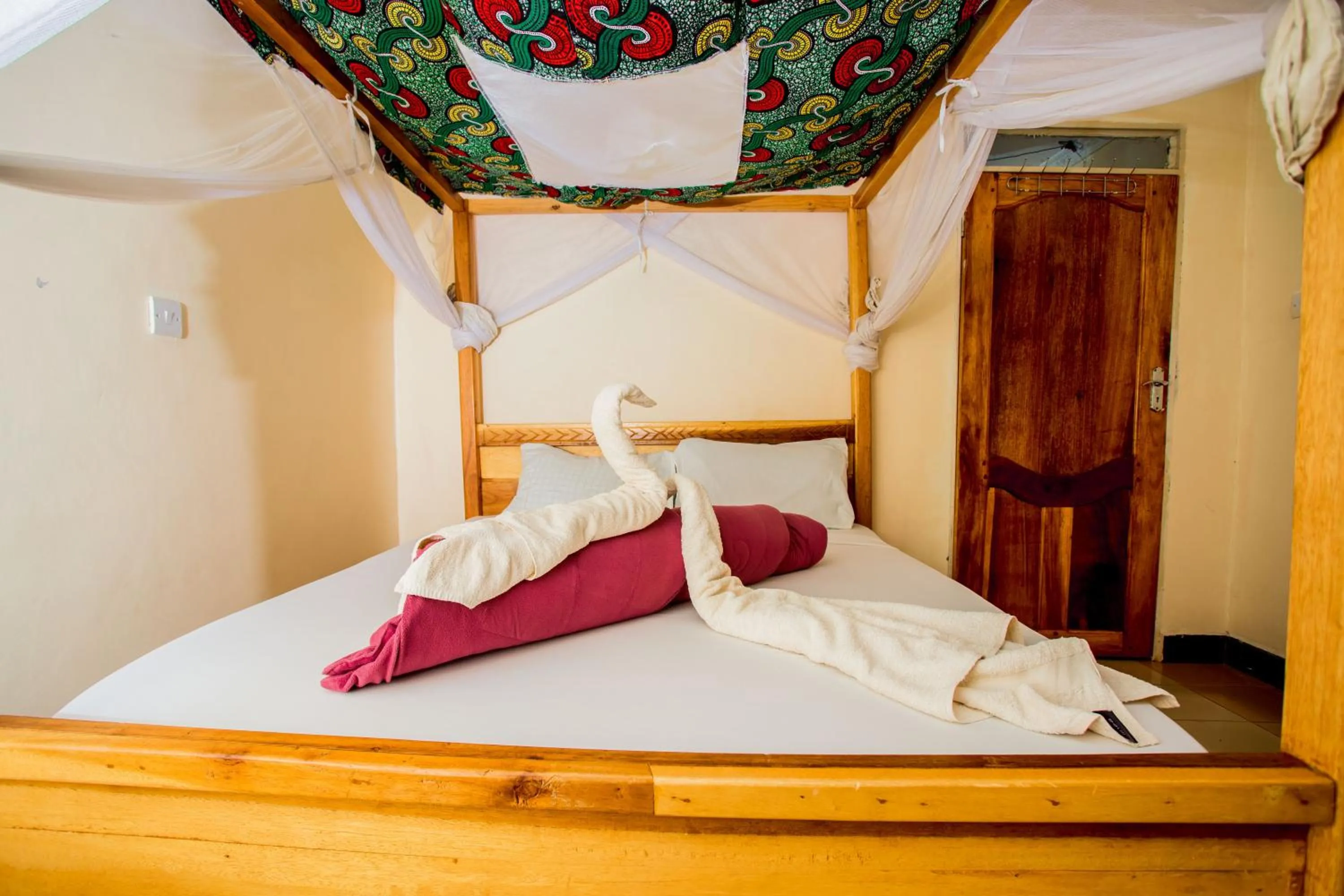 Bed in The Secret Garden Hotel Moshi