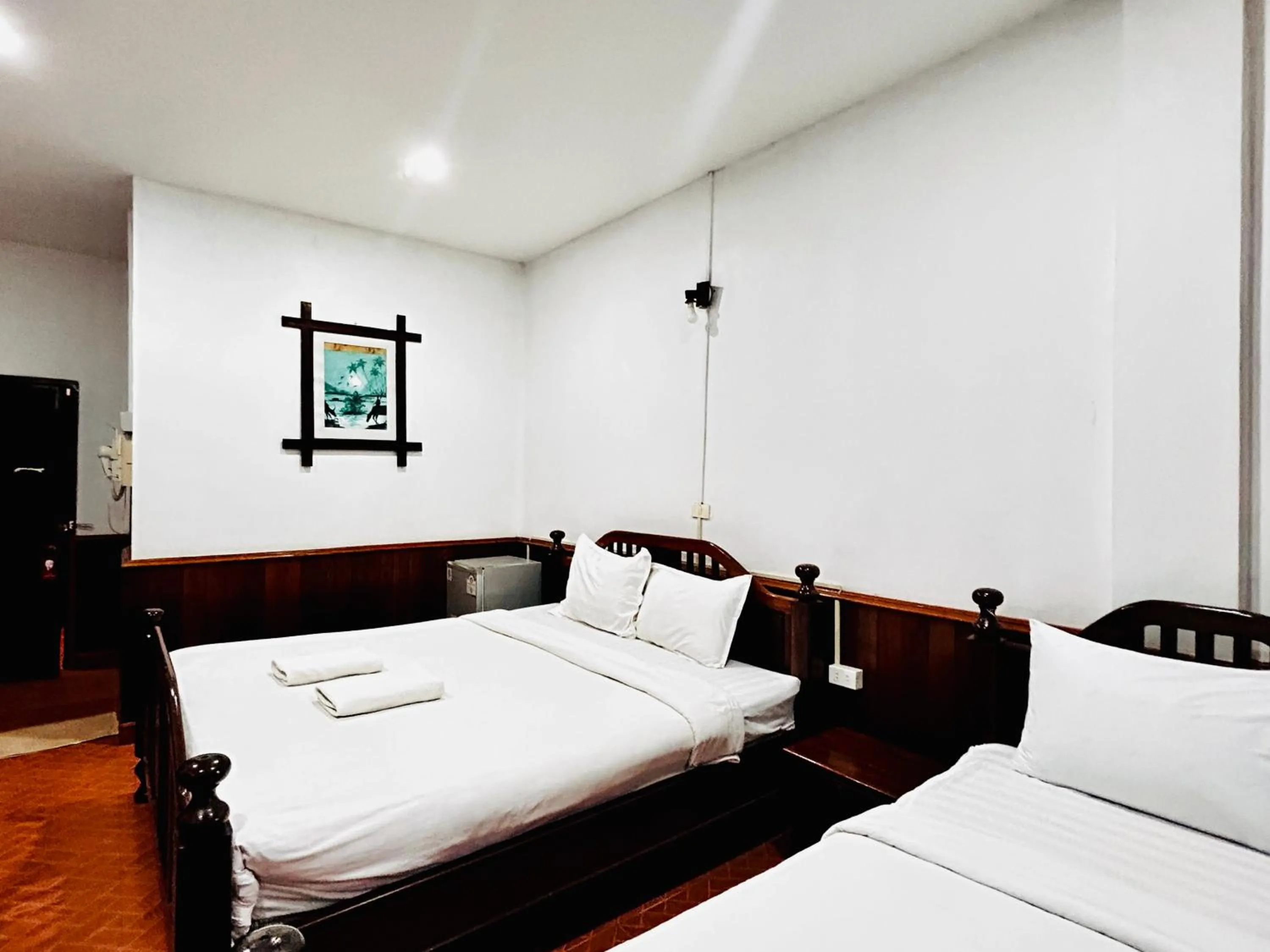 Bed in Domon Riverside Hotel