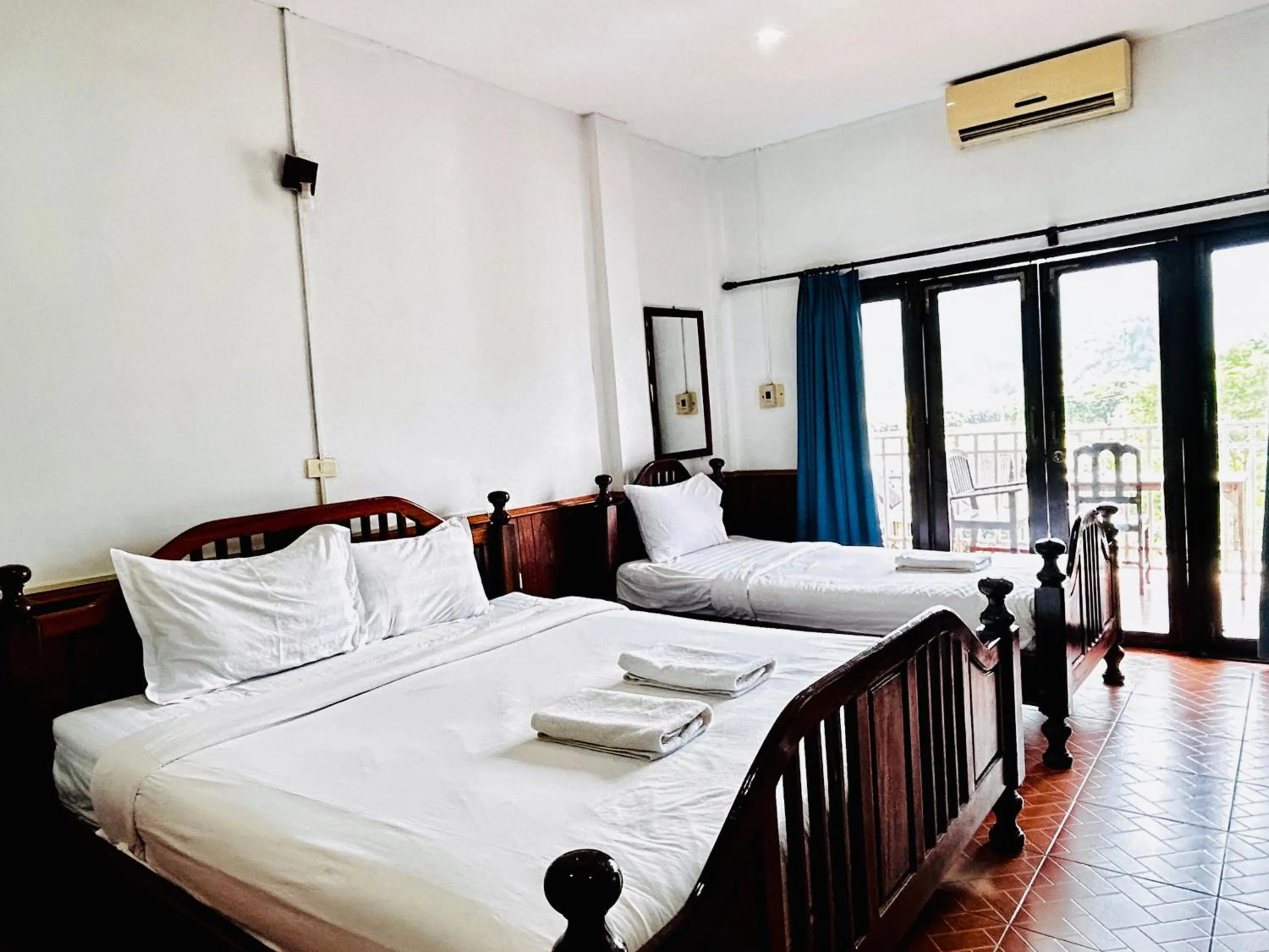 Bed in Domon Riverside Hotel