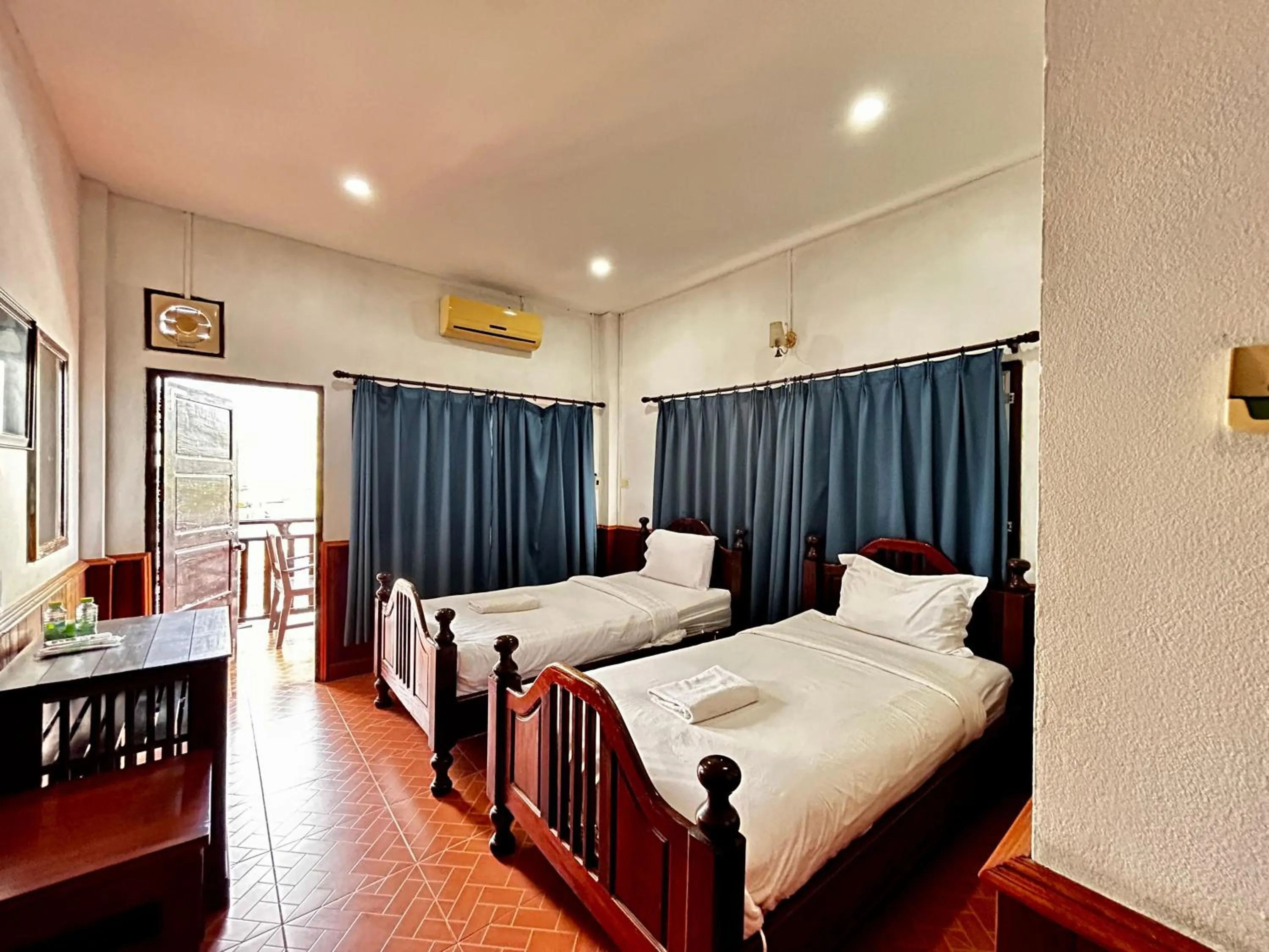 Bed in Domon Riverside Hotel