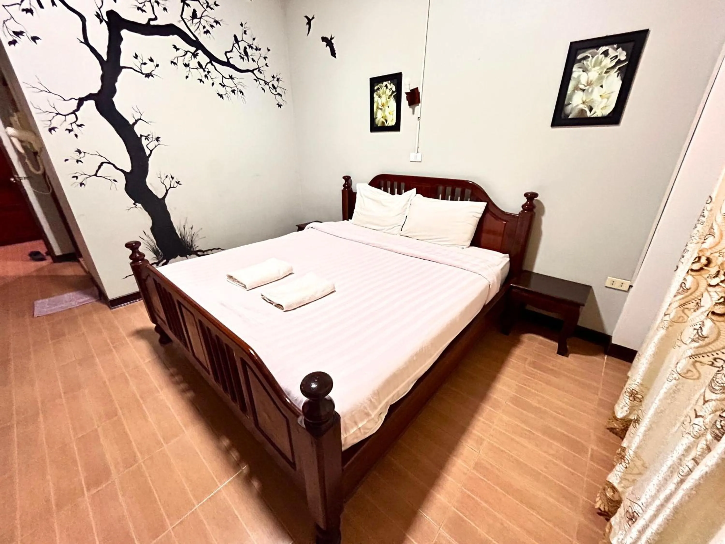 Bed in Domon Riverside Hotel