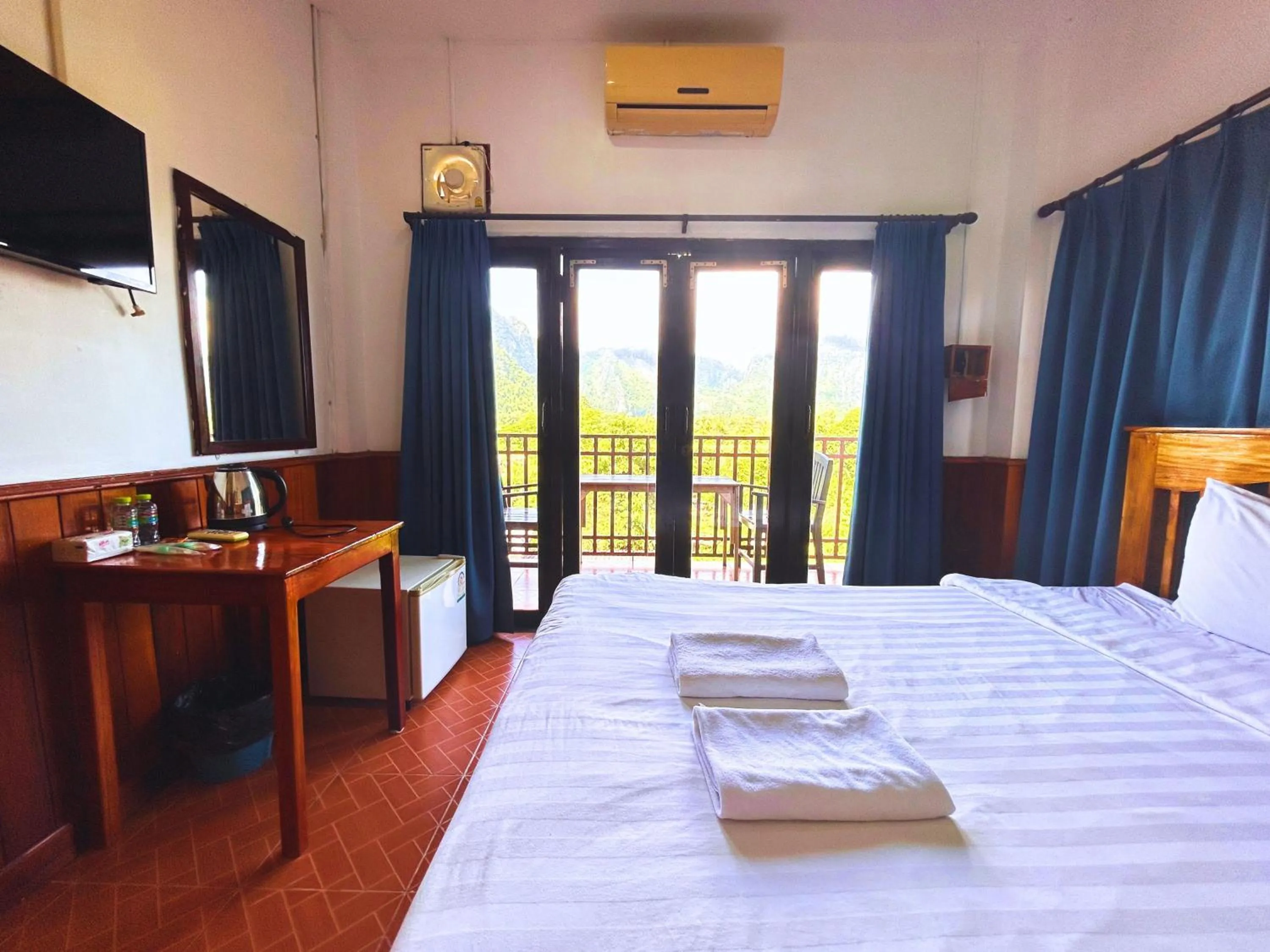 Bed in Domon Riverside Hotel