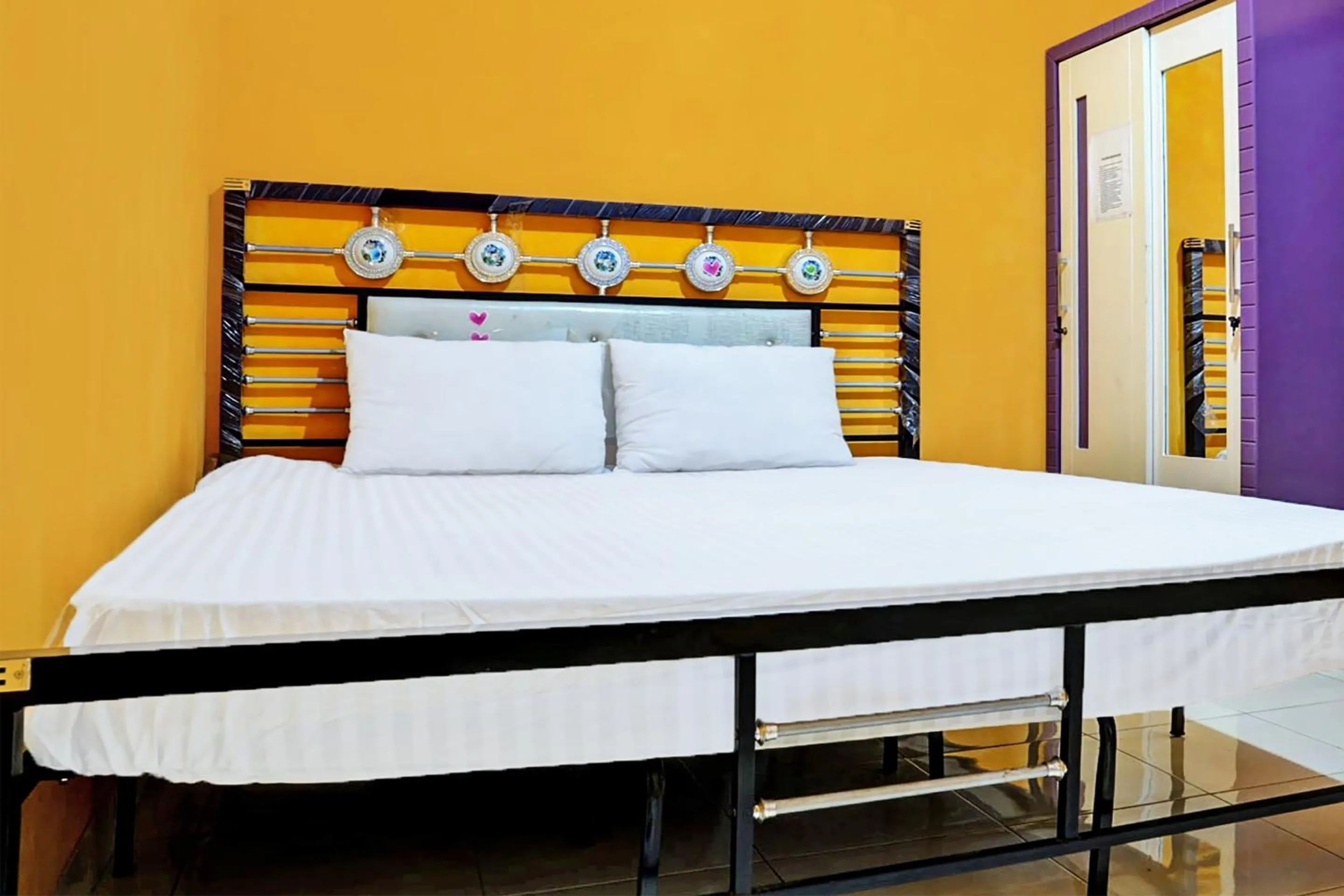 Bedroom in Hotel O Penginapan Hj Lilis Syariah