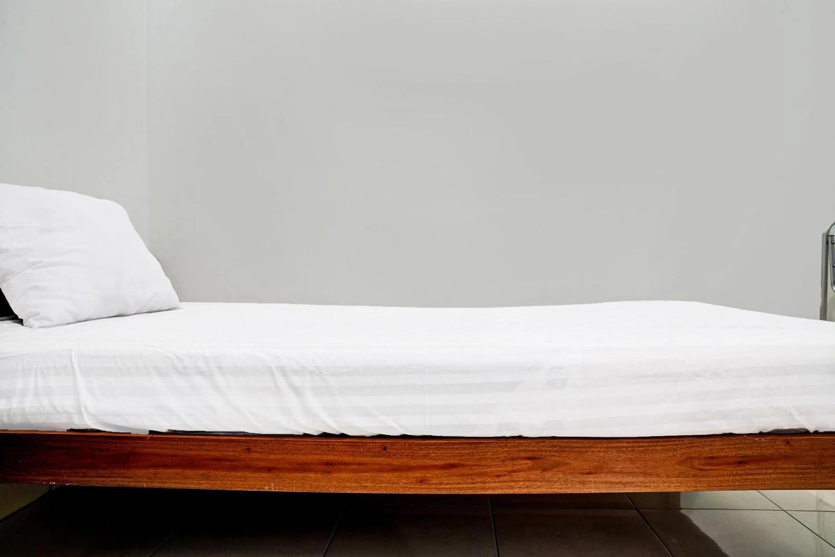 Bedroom in Hotel O Penginapan Hj Lilis Syariah