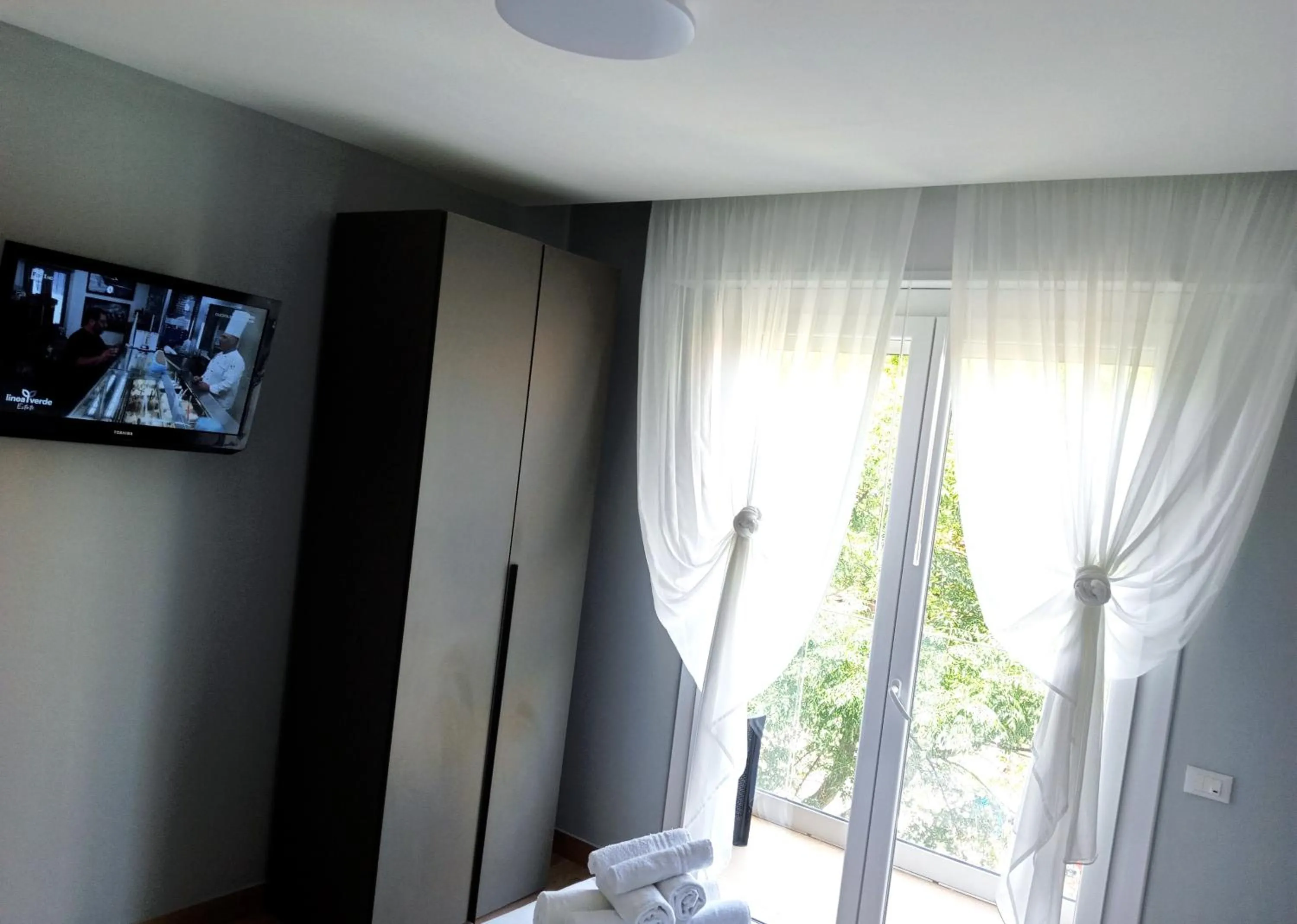 Communal lounge/ TV room, Bed in Residenza delle Nazioni