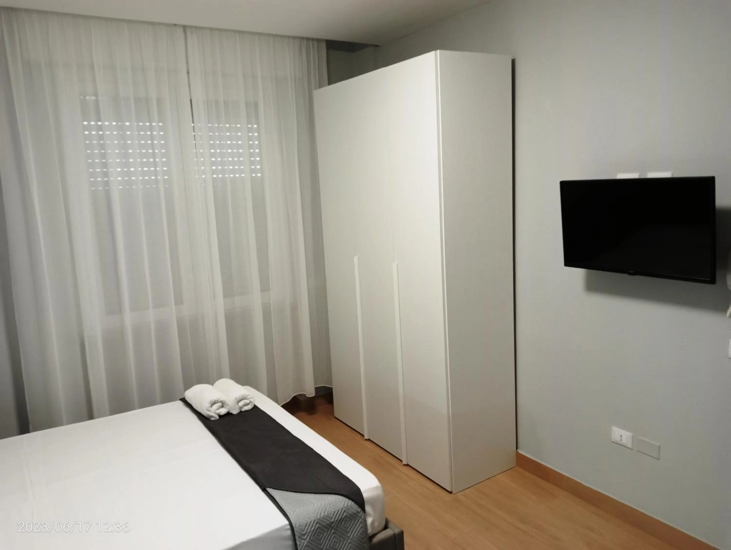 Communal lounge/ TV room, Bed in Residenza delle Nazioni