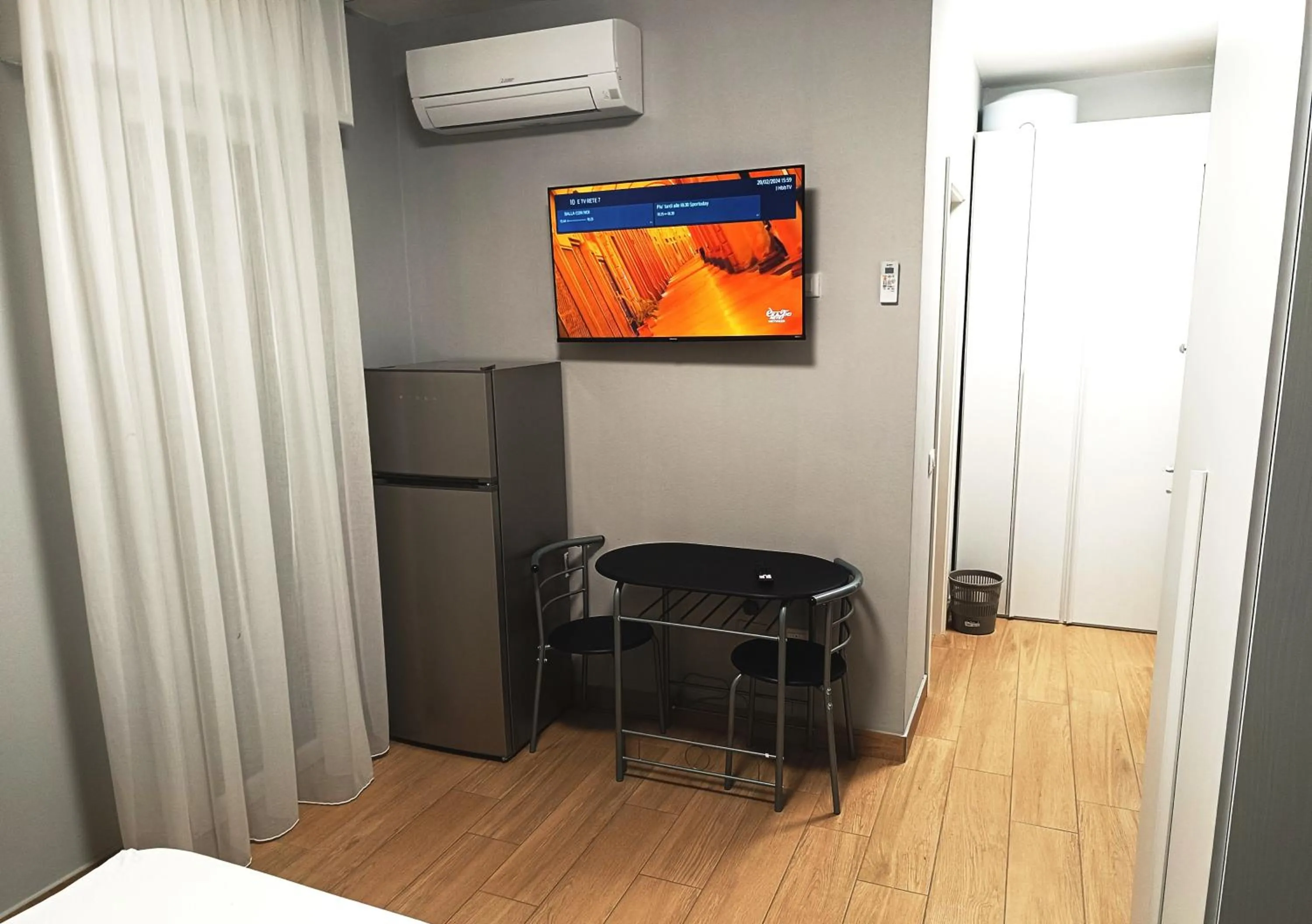 Communal lounge/ TV room, Bed in Residenza delle Nazioni