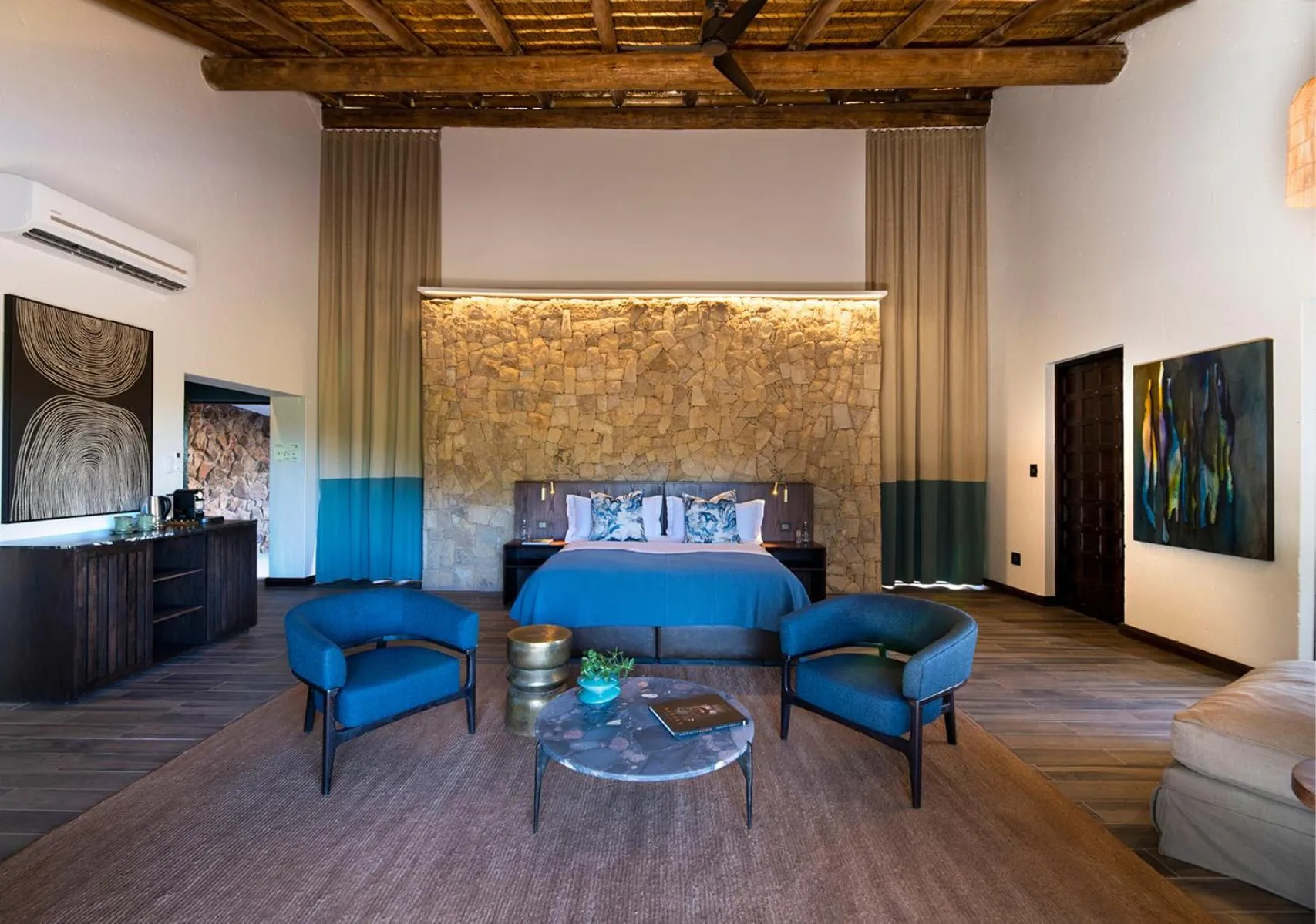 Seating area in Babohi at Qwabi Private Game Reserve by NEWMARK