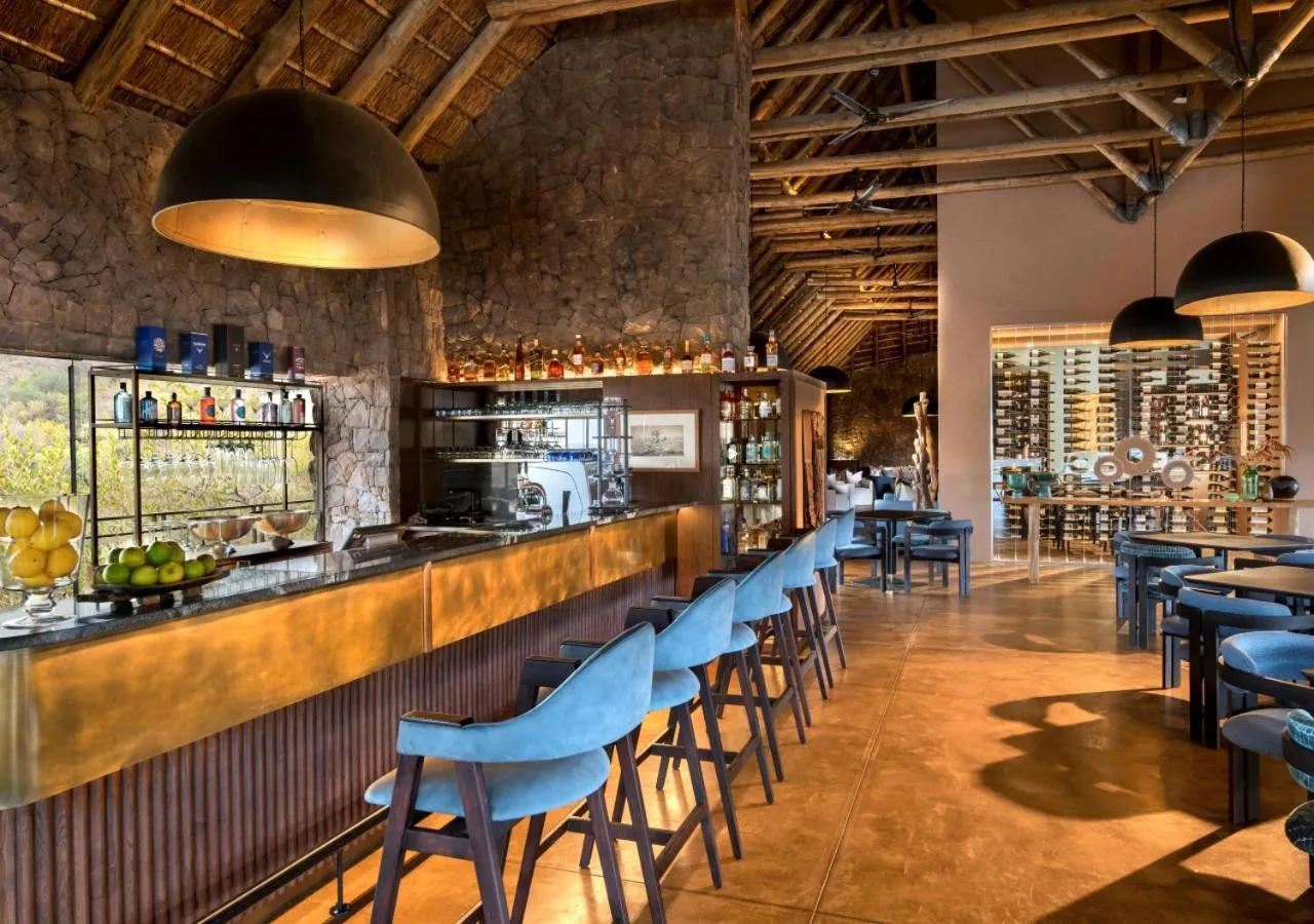 Lounge or bar in Babohi at Qwabi Private Game Reserve by NEWMARK