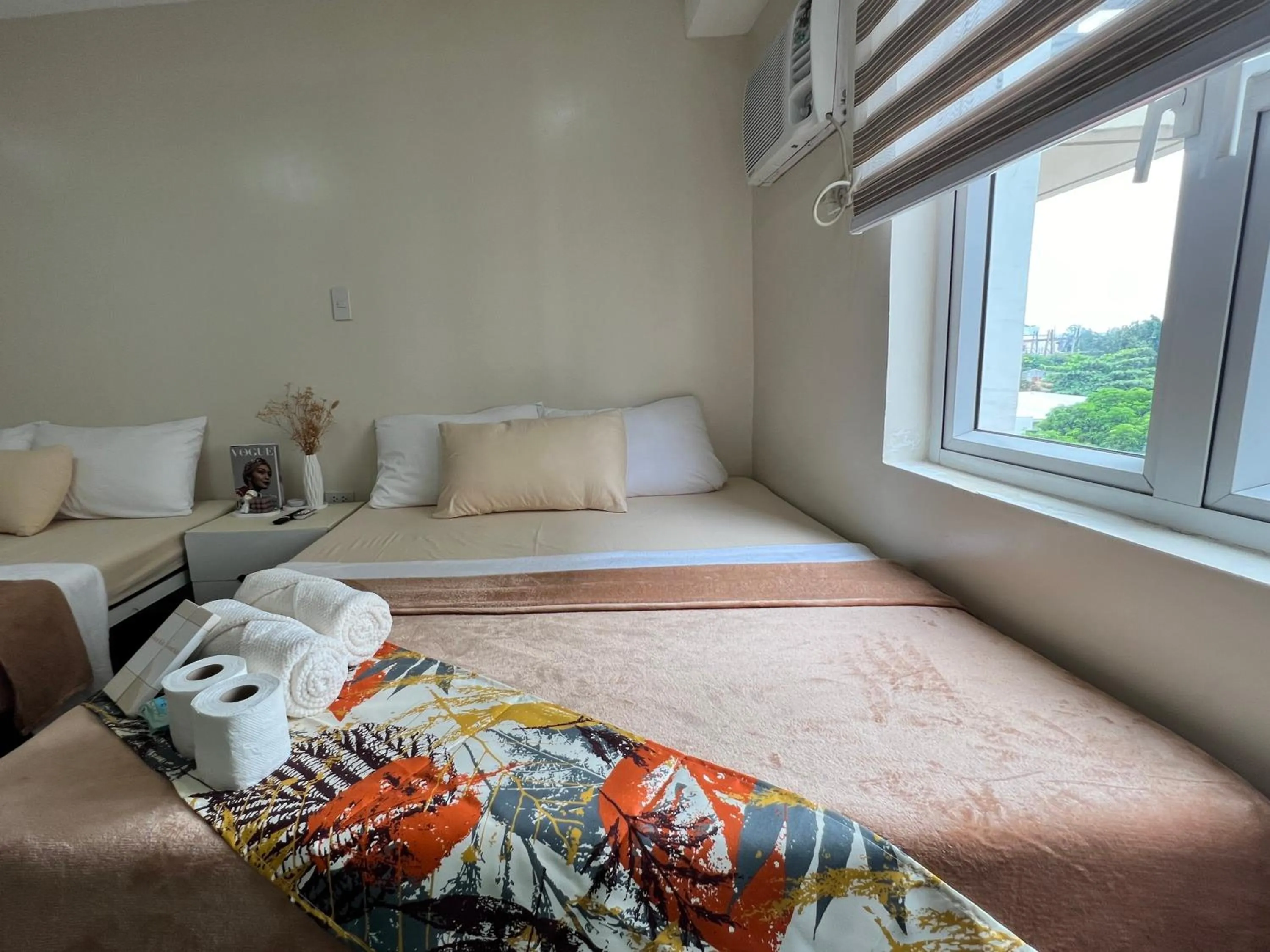 Bed in Staycation Condotel Room To Stay