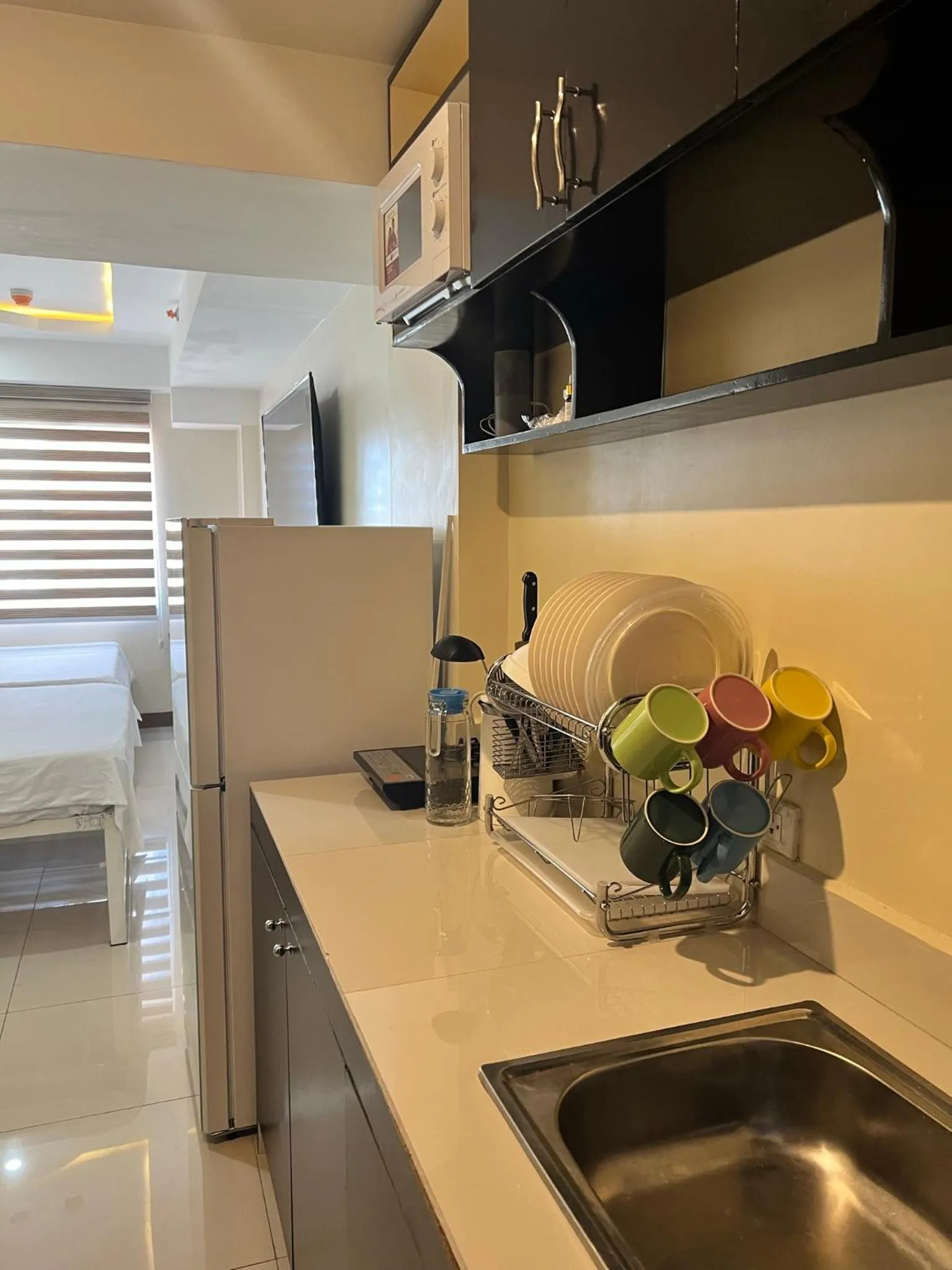 Kitchen or kitchenette in Staycation Condotel Room To Stay