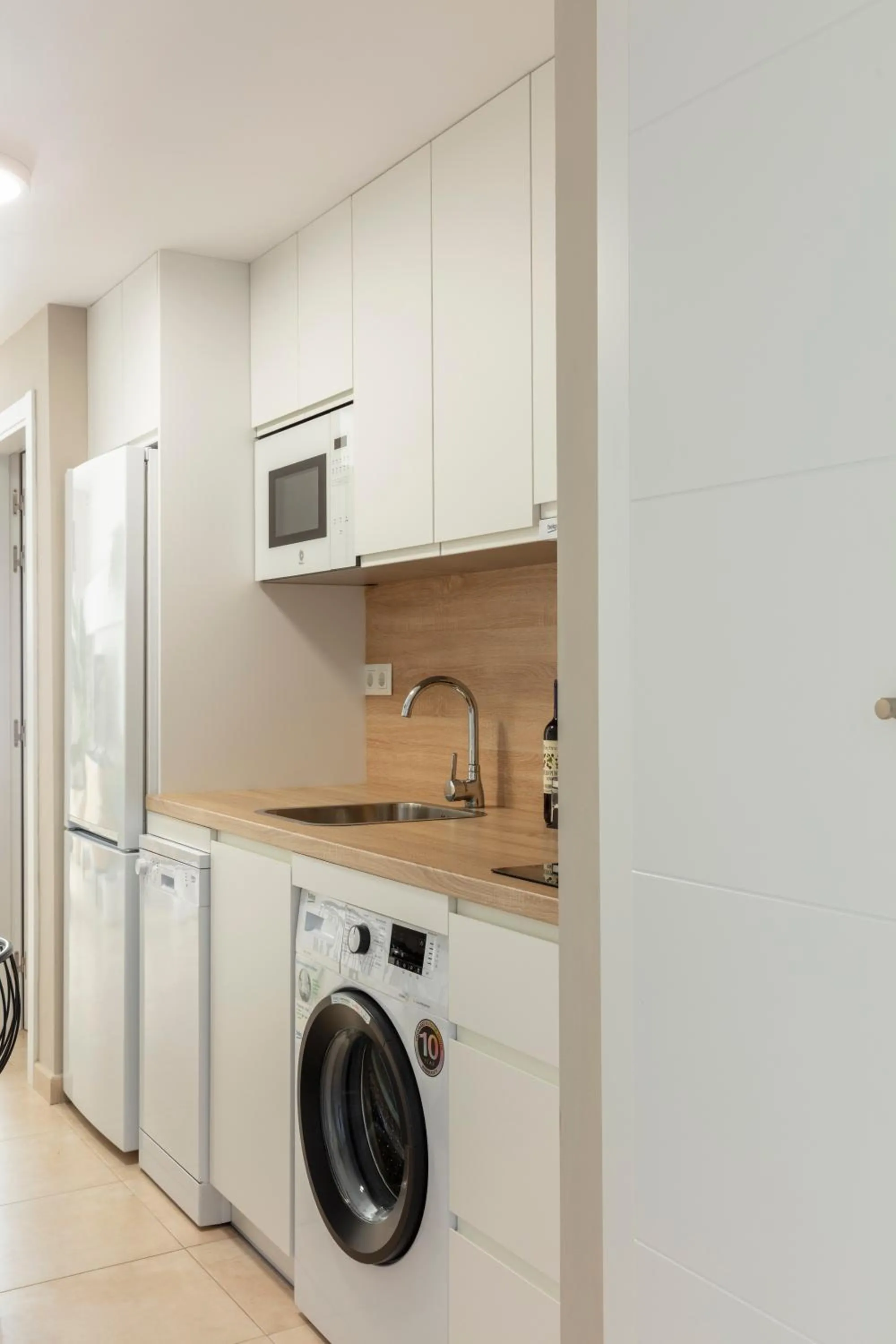 Kitchen or kitchenette in Apartamentos Martalia Áticos Deluxe